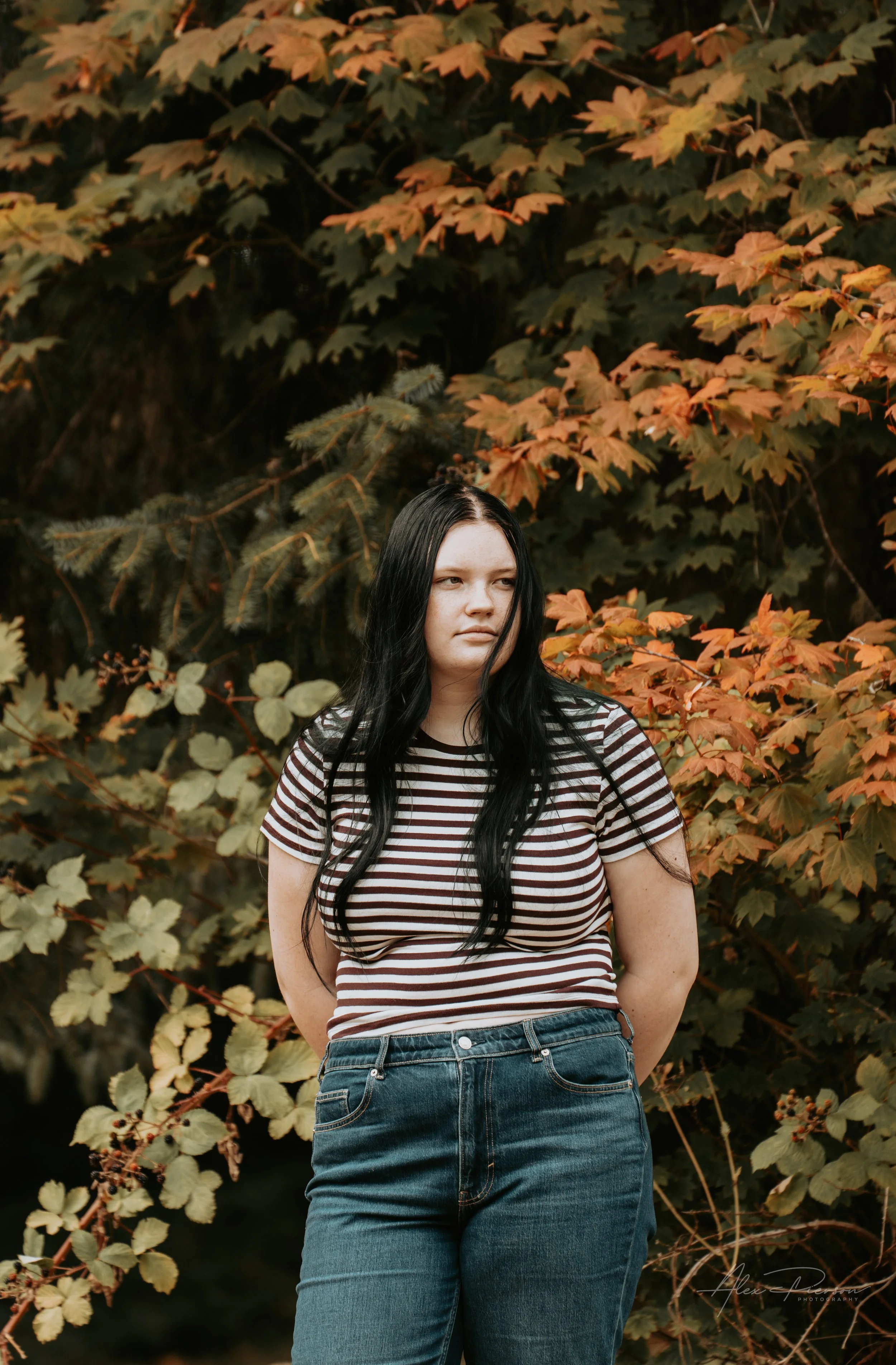 A portrait of a young lady wearing a black and white striped shirt during a family photoshoot in Montesano, WA- – Pacific Northwest lifestyle family and children's photography.