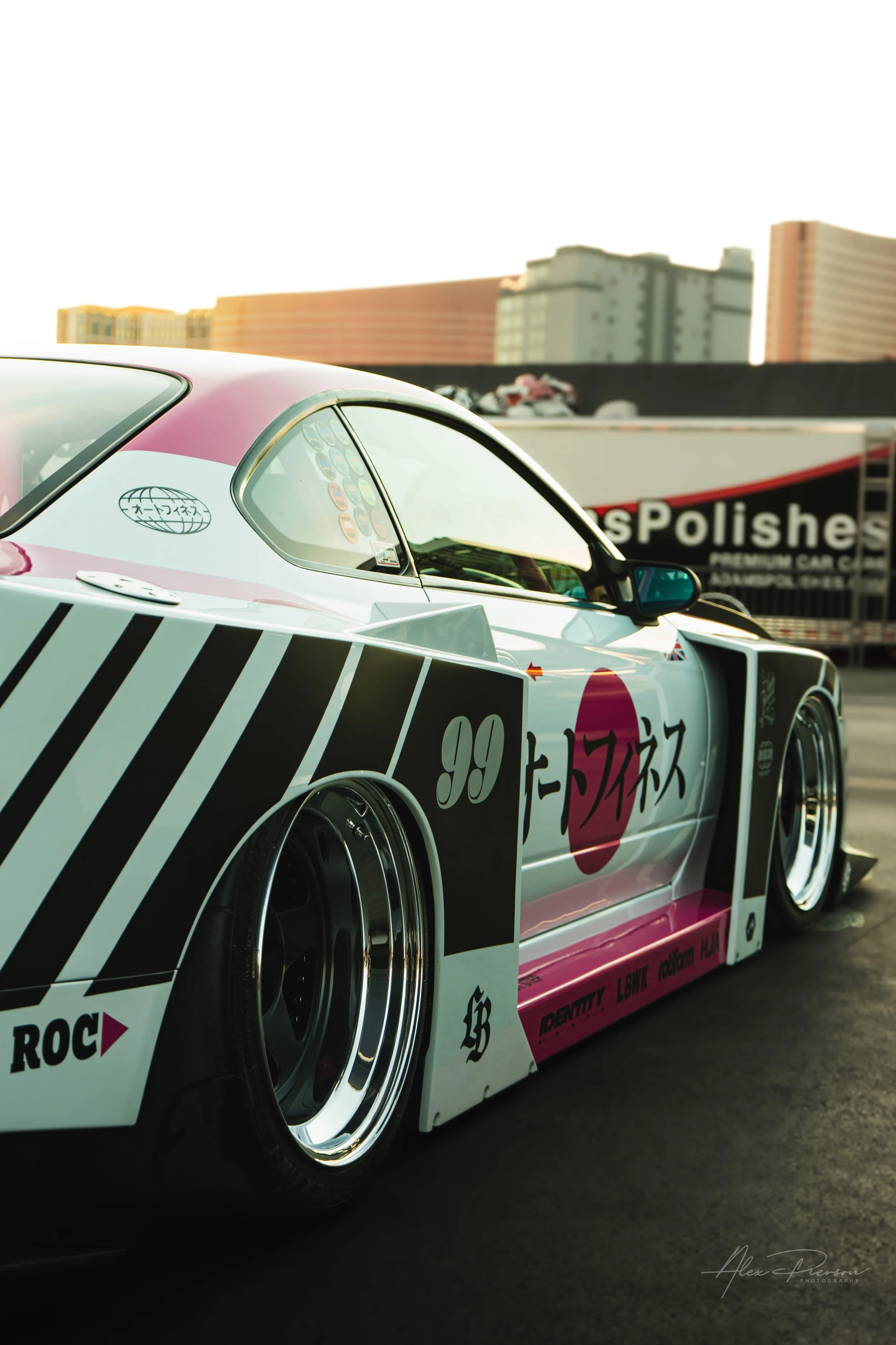 Side profile close-up of a slammed Nissan S15 showing deep dish wheels and Liberty Walk widebody fenders.

Gallery Caption: Form meets function. A close-up side profile of the Nissan S15 showcasing the iconic Liberty Walk bolt-on overfenders and deep