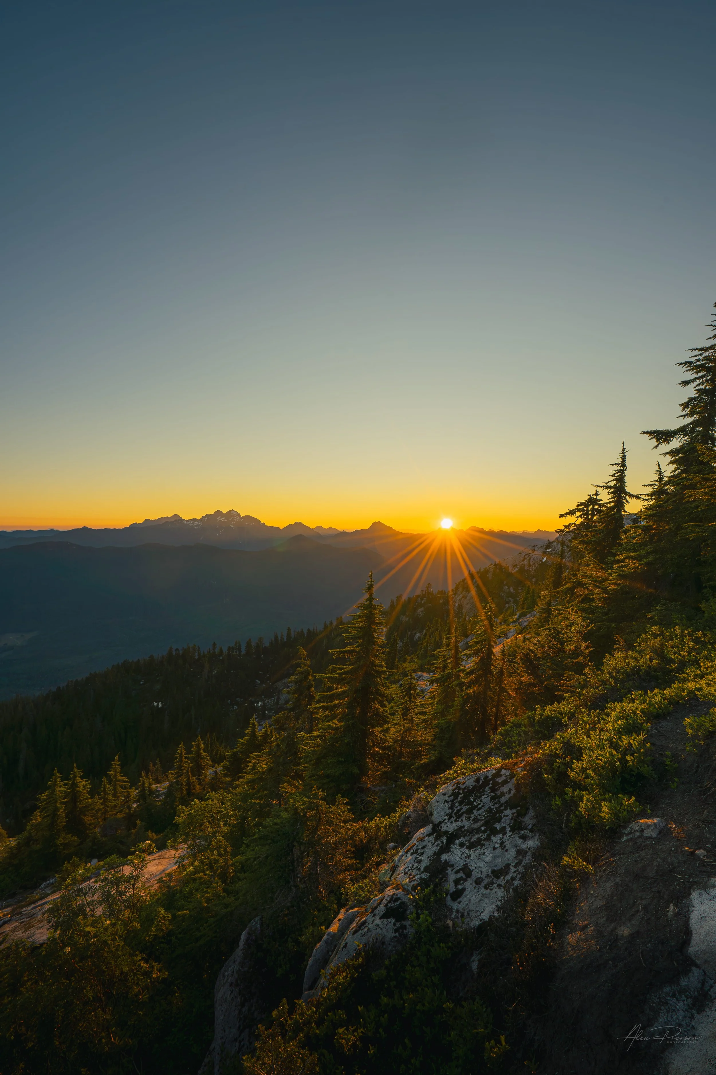 golden-hour-sunburst-alpine-ridge-mt-rainier.jpg
