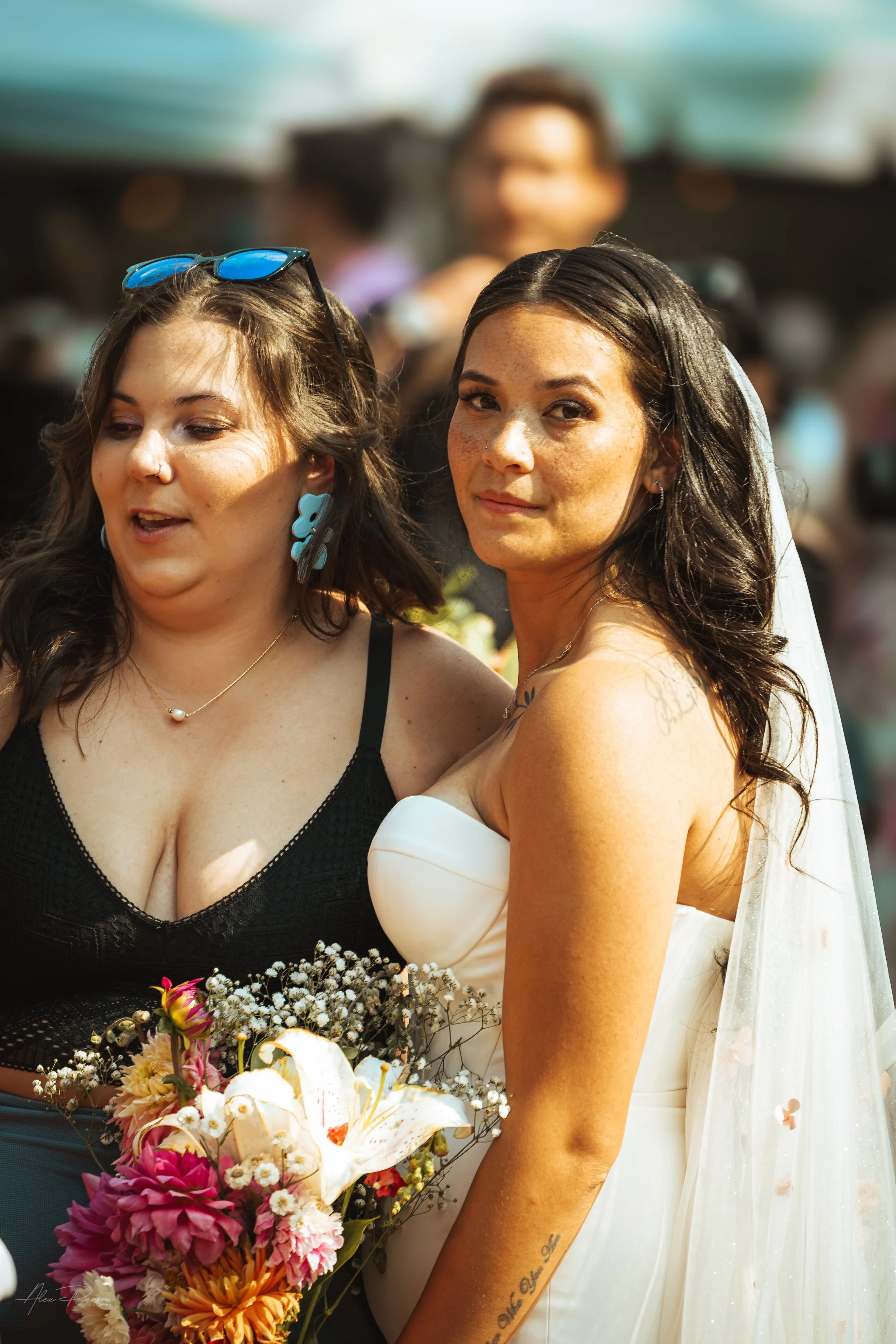 bride and a guest posing during a wedding in Olympia, wa