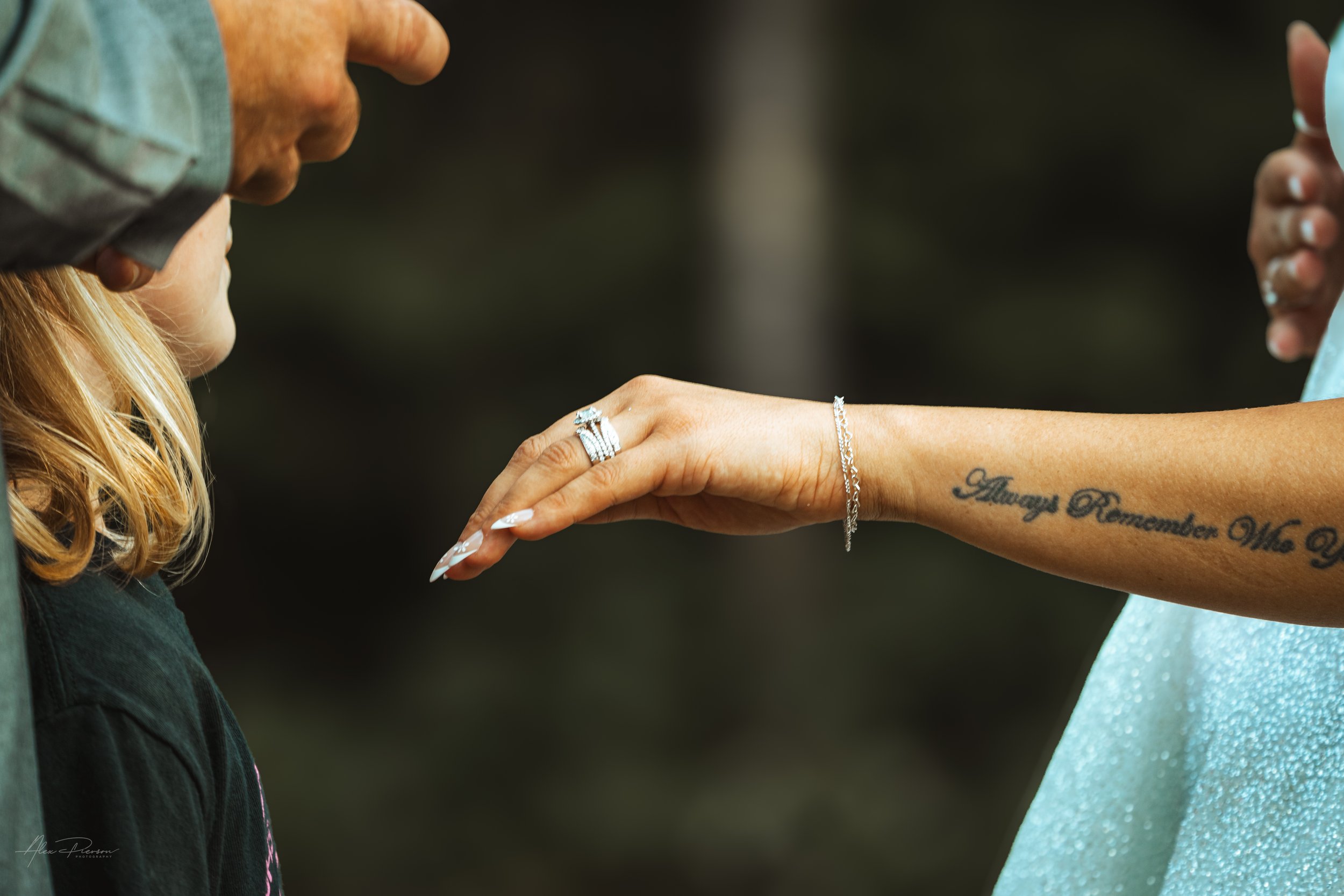 bride showing off her new ring in a wedding in Olympia, wa