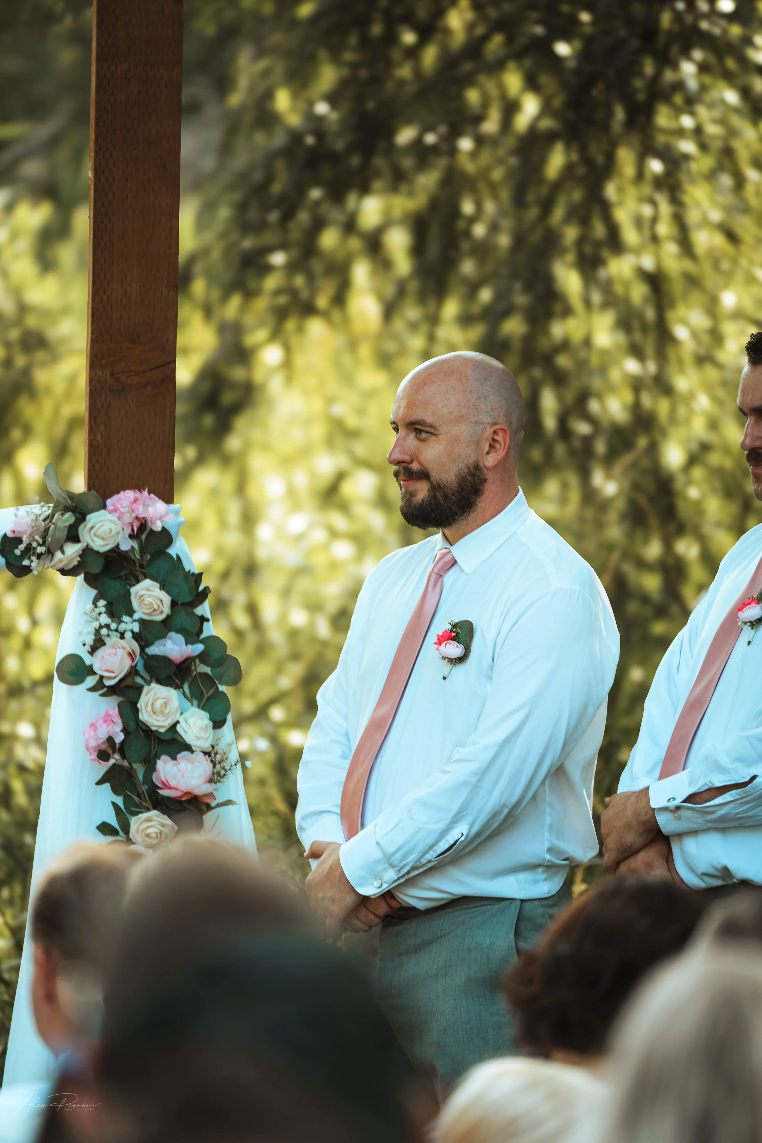 groomsmen looking at the bride and groom getting married in Olympia, WA