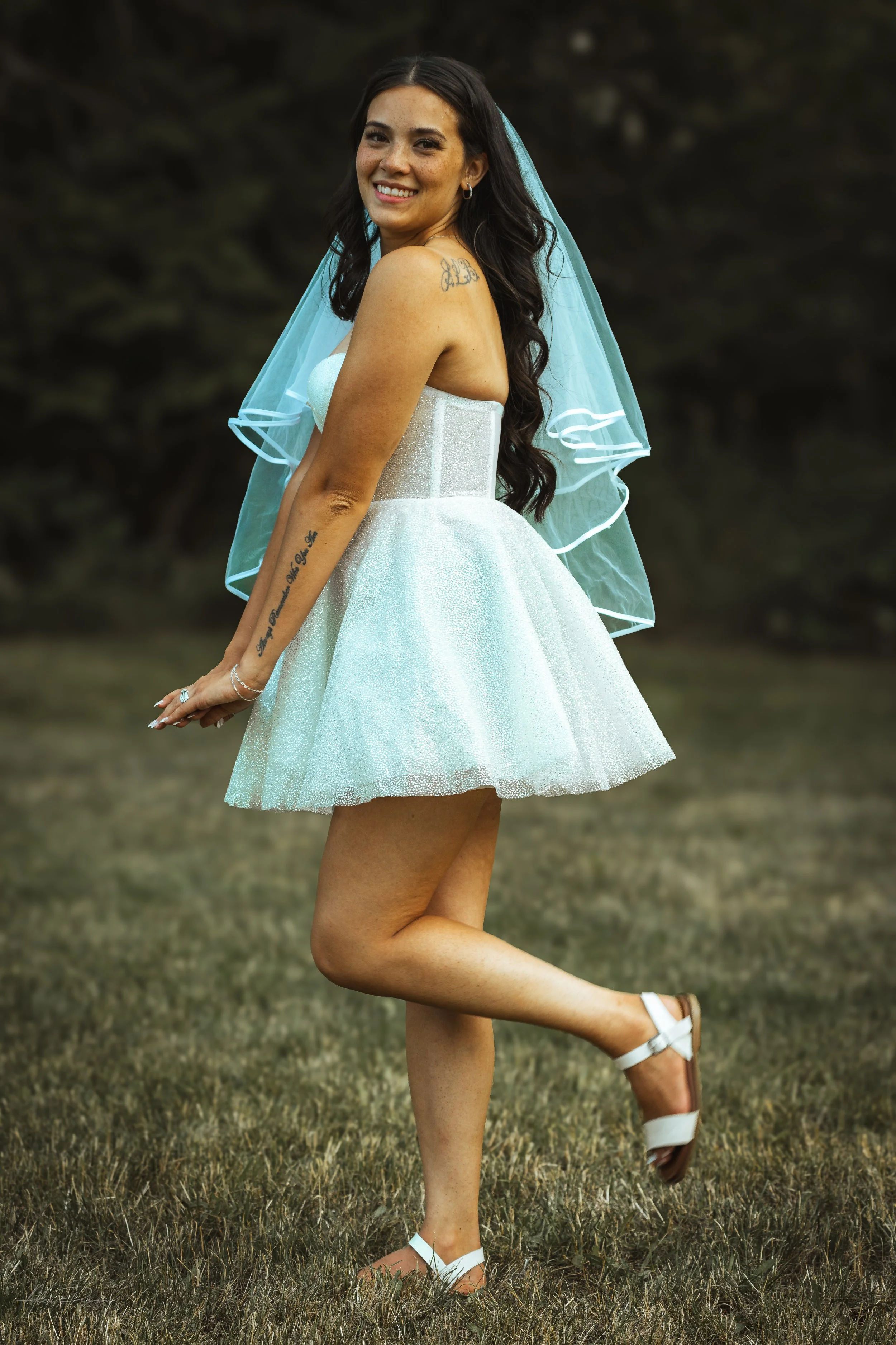 bride showing off her dress during her wedding in Olympia, wa