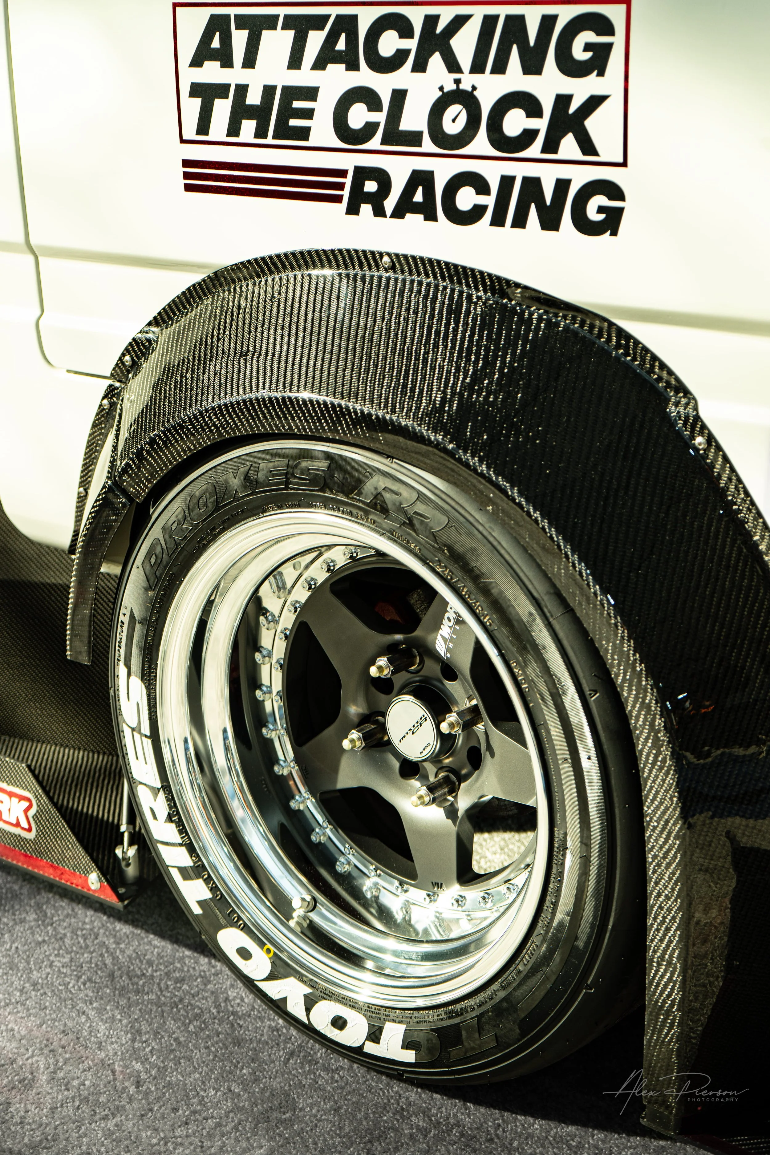 Close-up of carbon fiber widebody fender flare and multipiece Work Wheels on a white Time Attack Kei truck at the SEMA Show in Las Vegas.
Discover the ultimate Time Attack Kei truck build from SEMA Las Vegas. Close-up automotive photography featuring