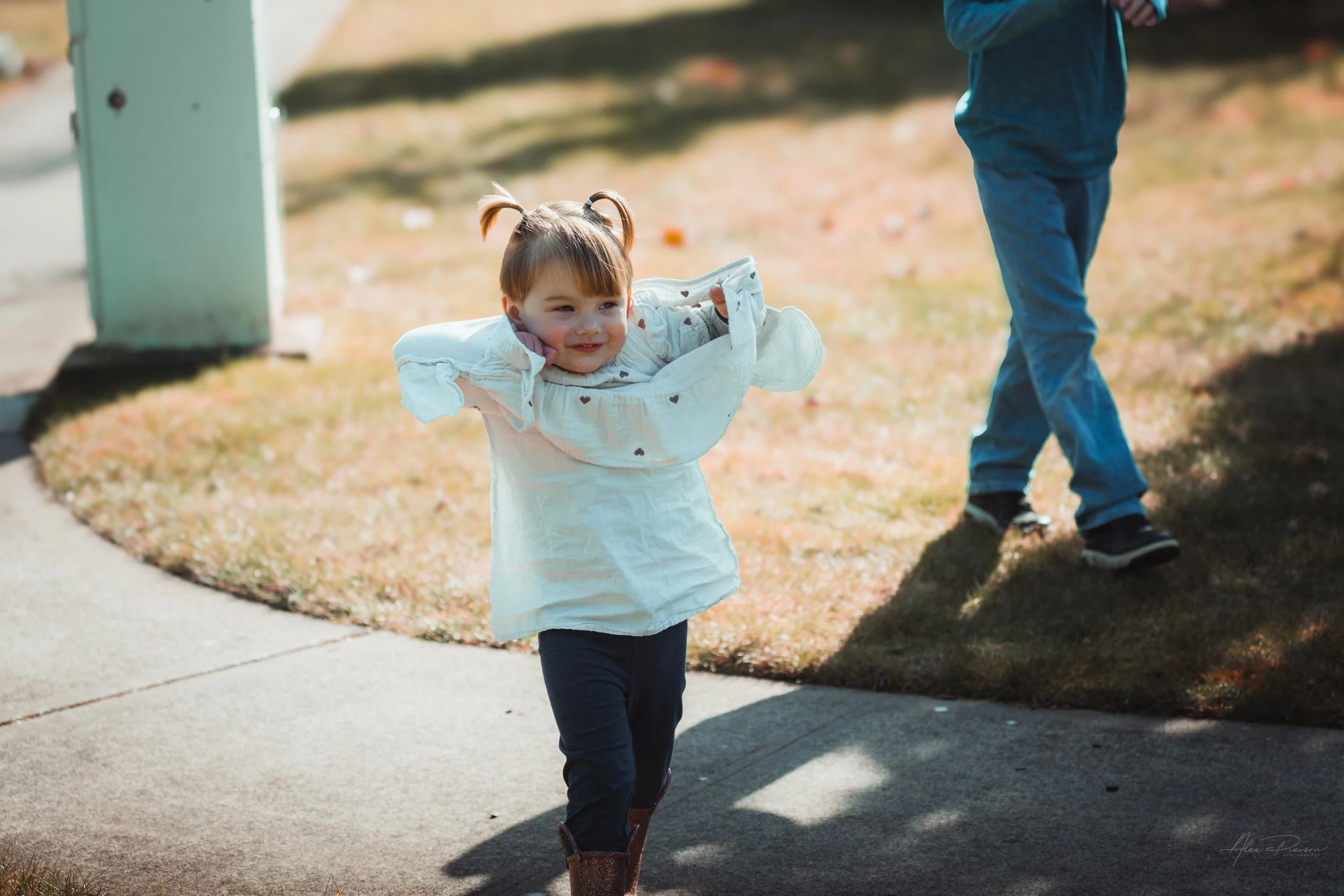 little girl having fun during a family photo shoot  in Tumwater, WA – Pacific Northwest lifestyle family and children's photography.