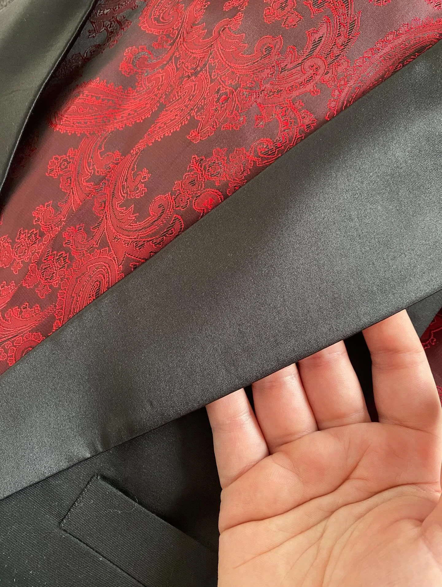 We&rsquo;re loving this recent order and the style choices that were made. 

This elegant black suit opens up to a fiery red patterned lining that&rsquo;s pure personality. 

Add in a unique smooth silky lapel finish and you&rsquo;ve got a winning fo
