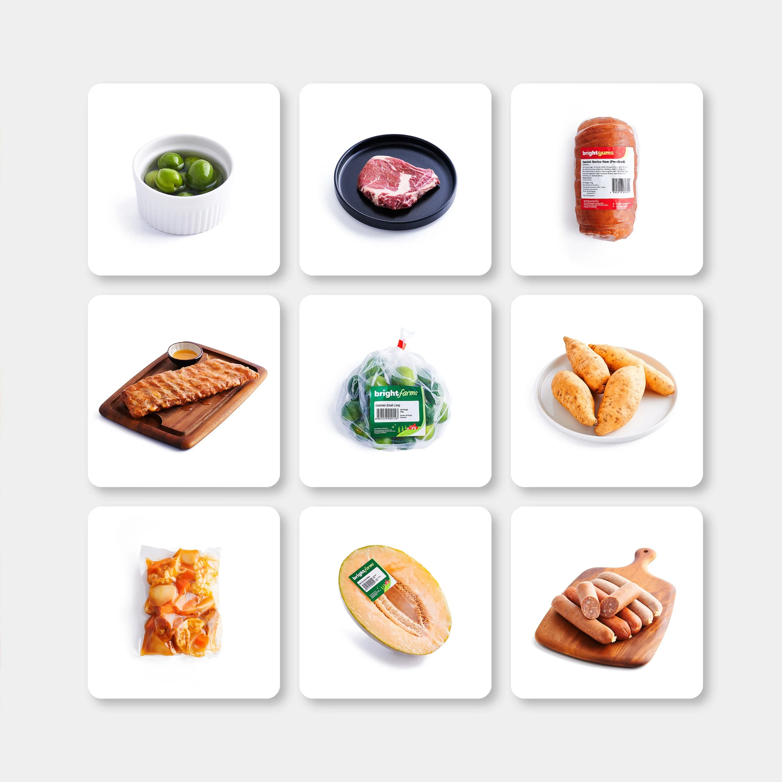 A grid of nine images featuring food ingredients including green olives, a raw steak, a roll of cured ham, cooked bacon, limes, taro root, peeled sweet potatoes, diced chicken, and assorted sausages.