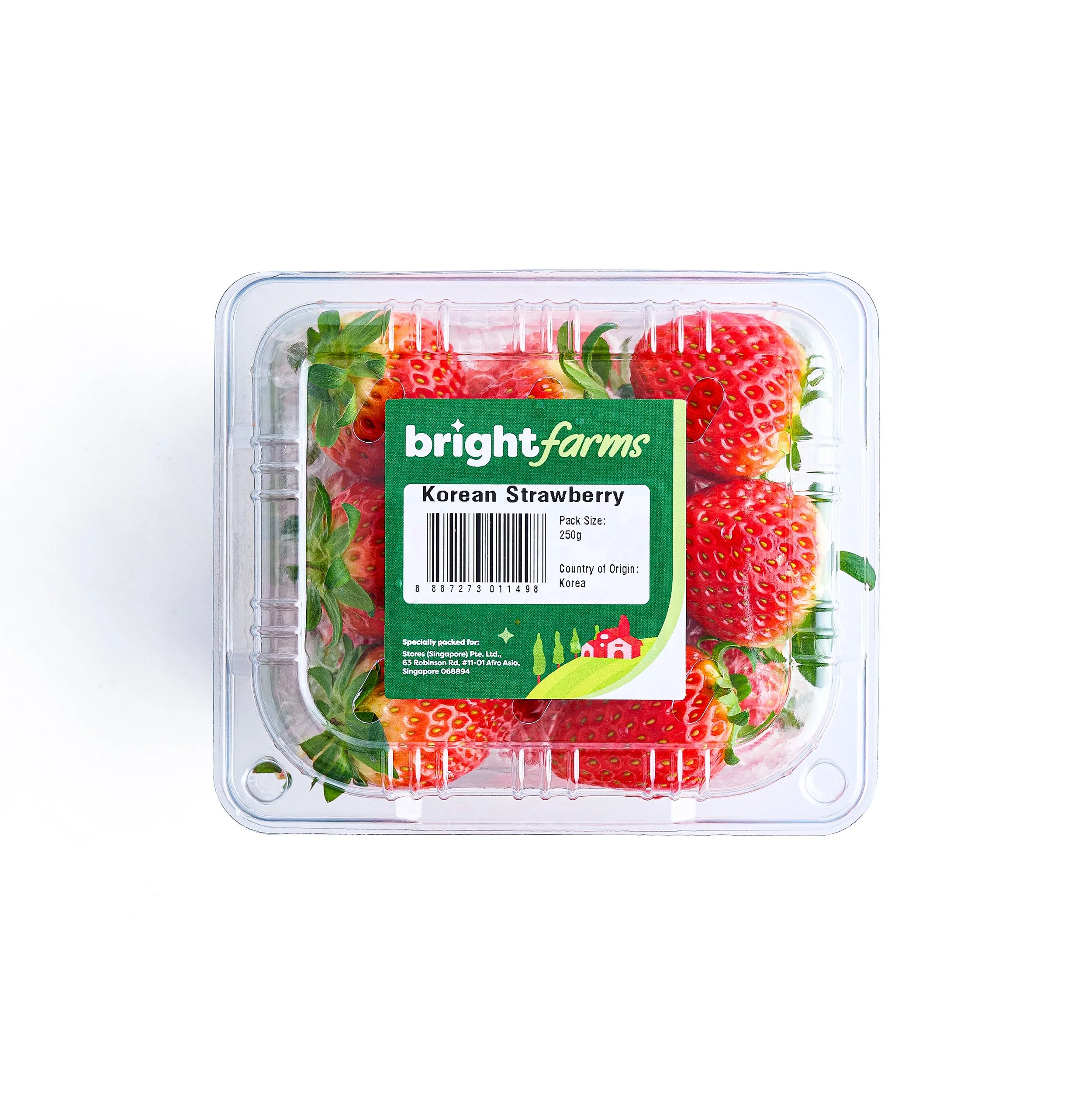 Clear plastic container of fresh Korean strawberries with a green label from Bright Farms.