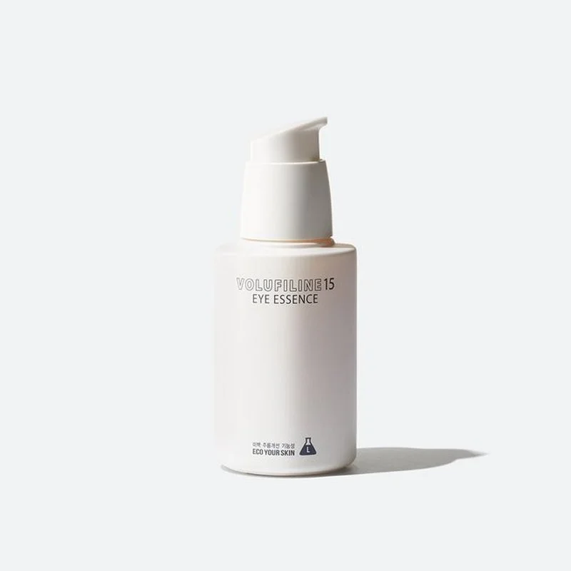 White bottle of Volufiline 15 Eye Essence with a pump dispenser on a white background.
