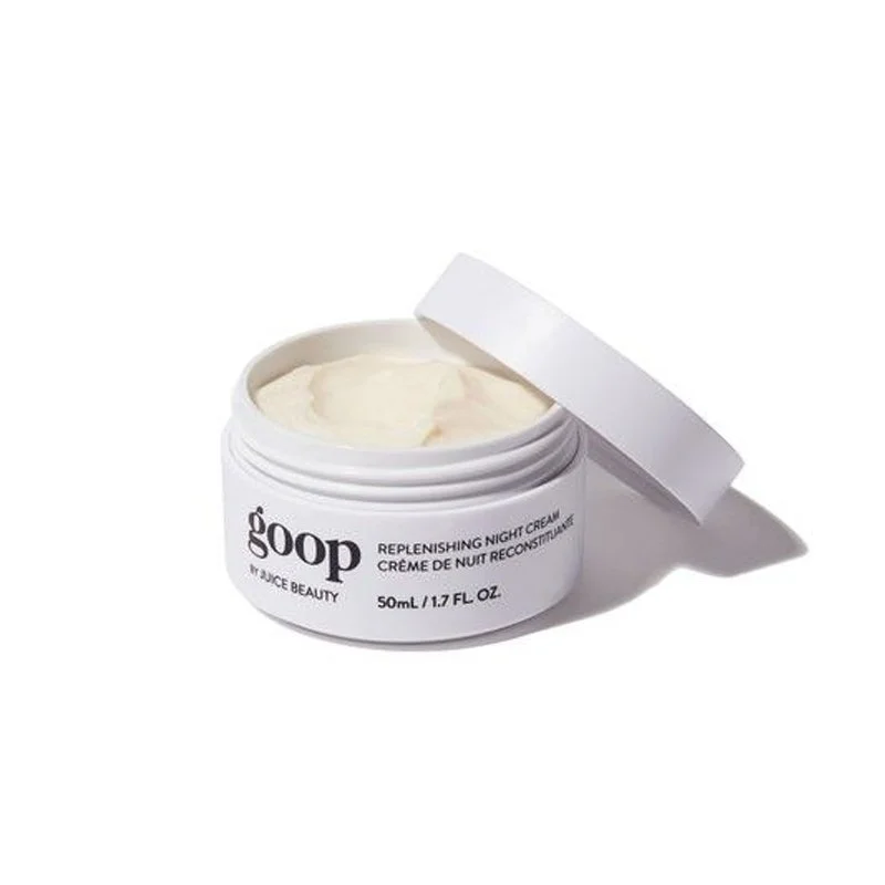 Open jar of gooP replenishing night cream with white lid, cream visible inside, on white background.