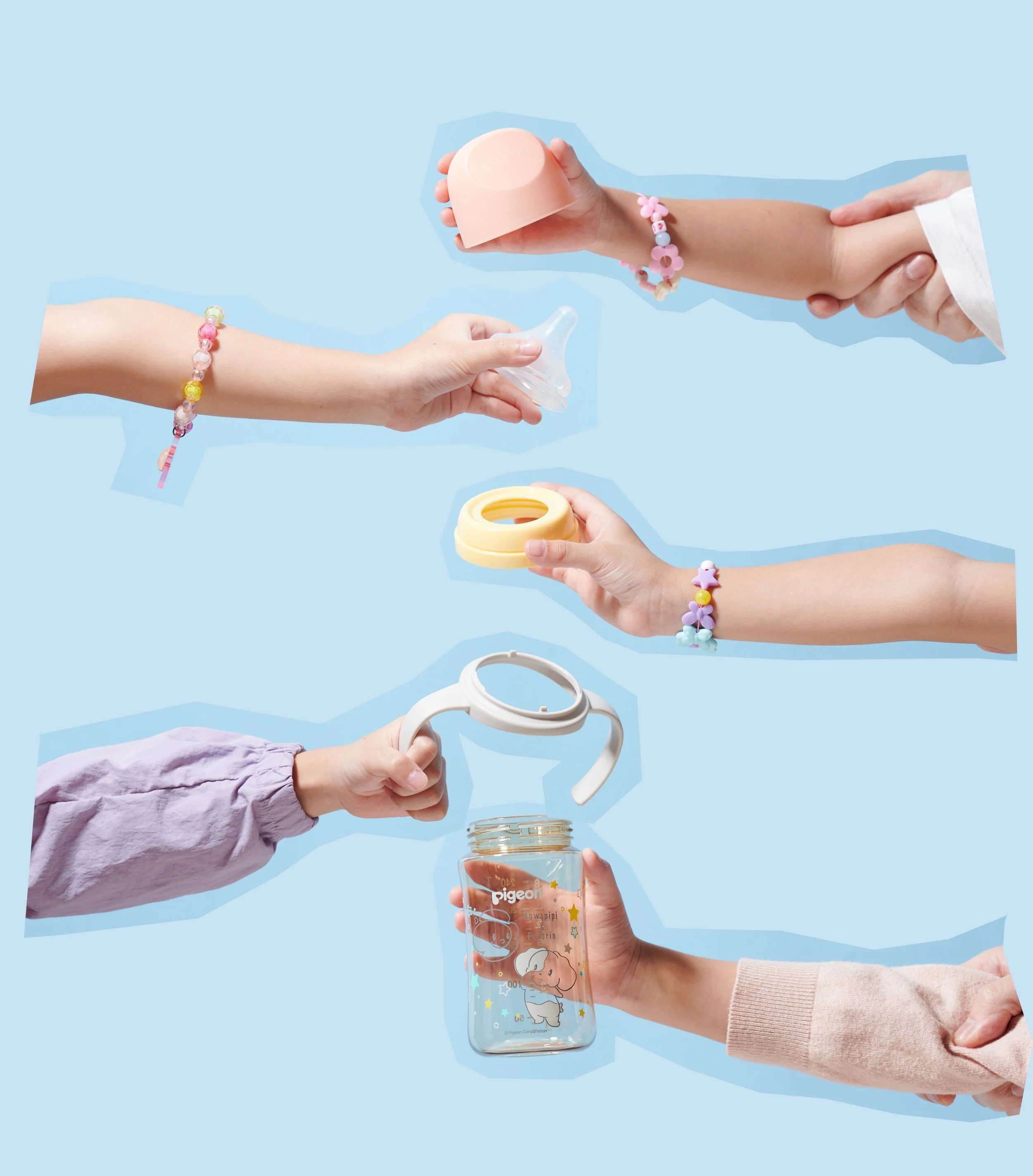 Multiple hands holding baby items including a pacifier, a baby bottle, a bottle ring, a teething ring, and a baby jar on a light blue background.
