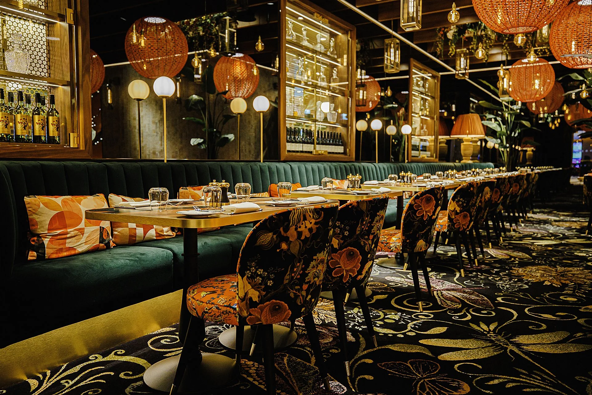 Wide shot of fixed seating and dining chairs in bar