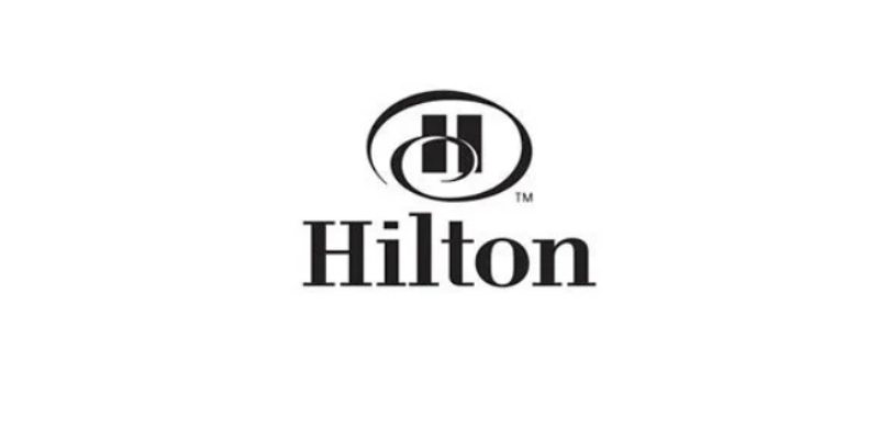 Hilton logo with black text and a circular symbol above the word 'Hilton' on a white background.