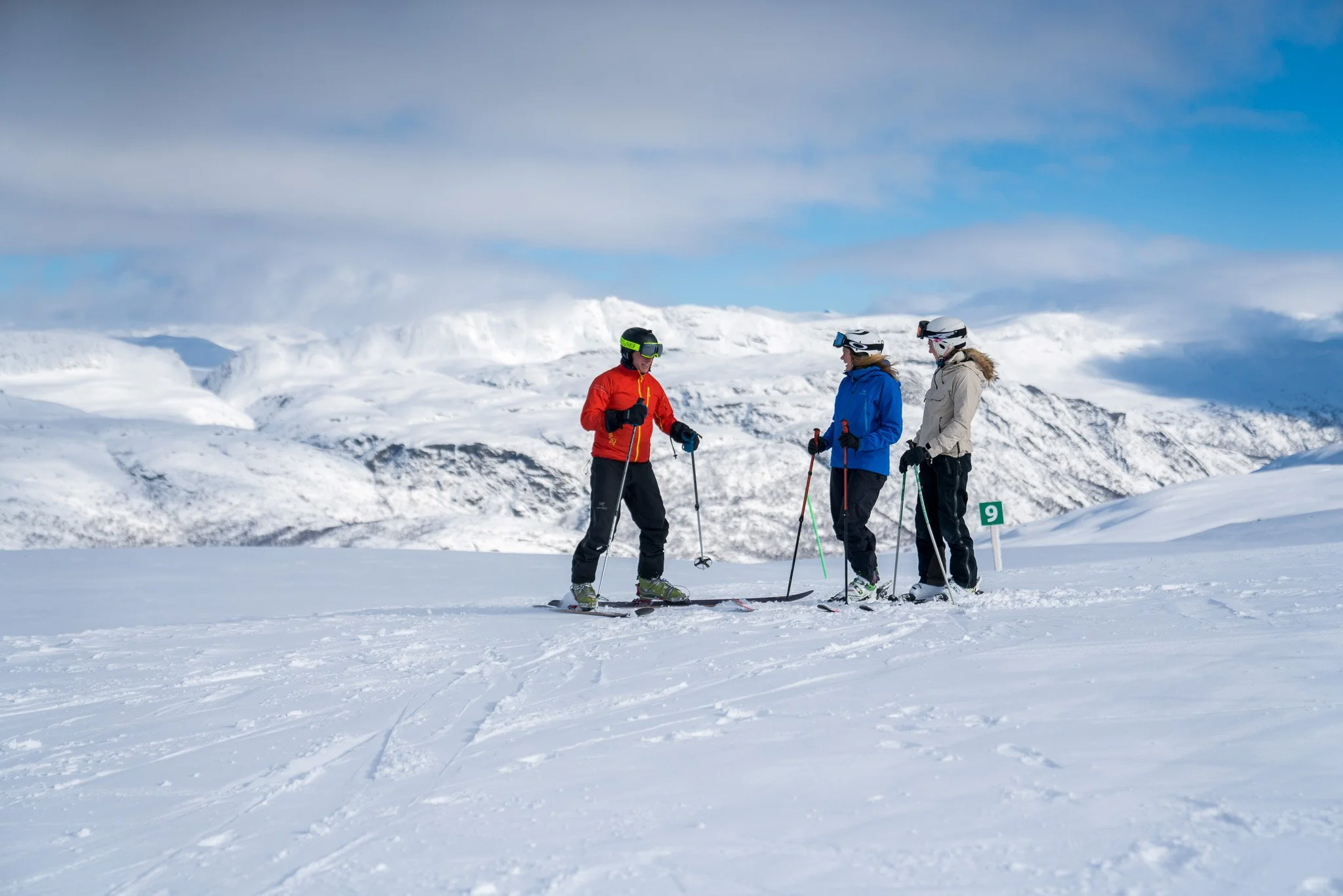 People Kayak across the bay in Lofoten