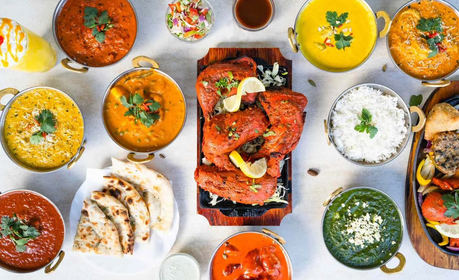 table-full-of-indian-food--1251033362-a924bf11f03344a1bb05dde19fba88b3.jpg