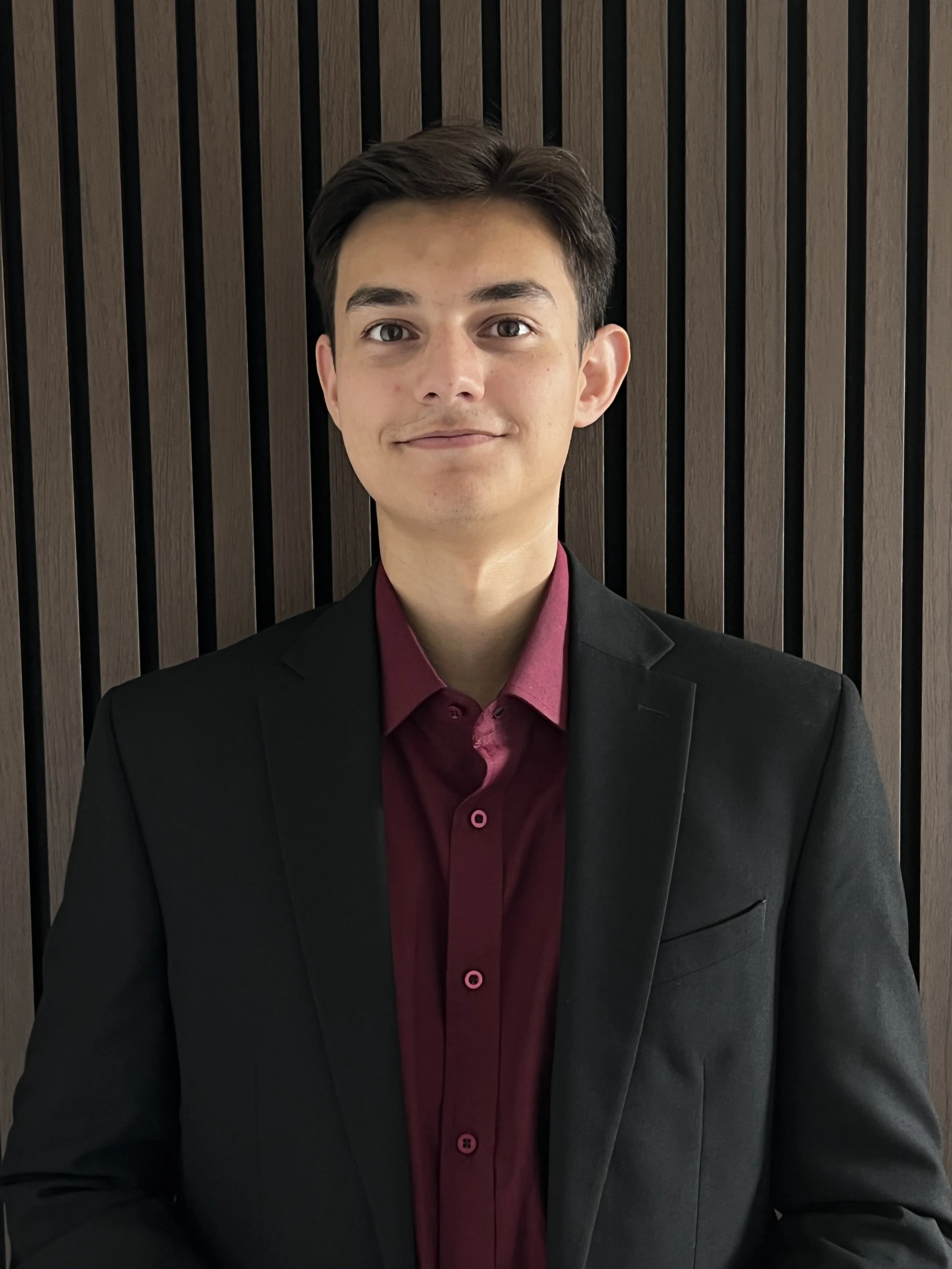 Leon Reeve, BCLR Limited, BCLR, BCLR Designs, Luxury Design Studio, Hertfordshire, Heritage, Graphic Design, Founder, Design Studio Founder, Black Blazer, Burgundy Shirt, Founder, Man, Men in Business