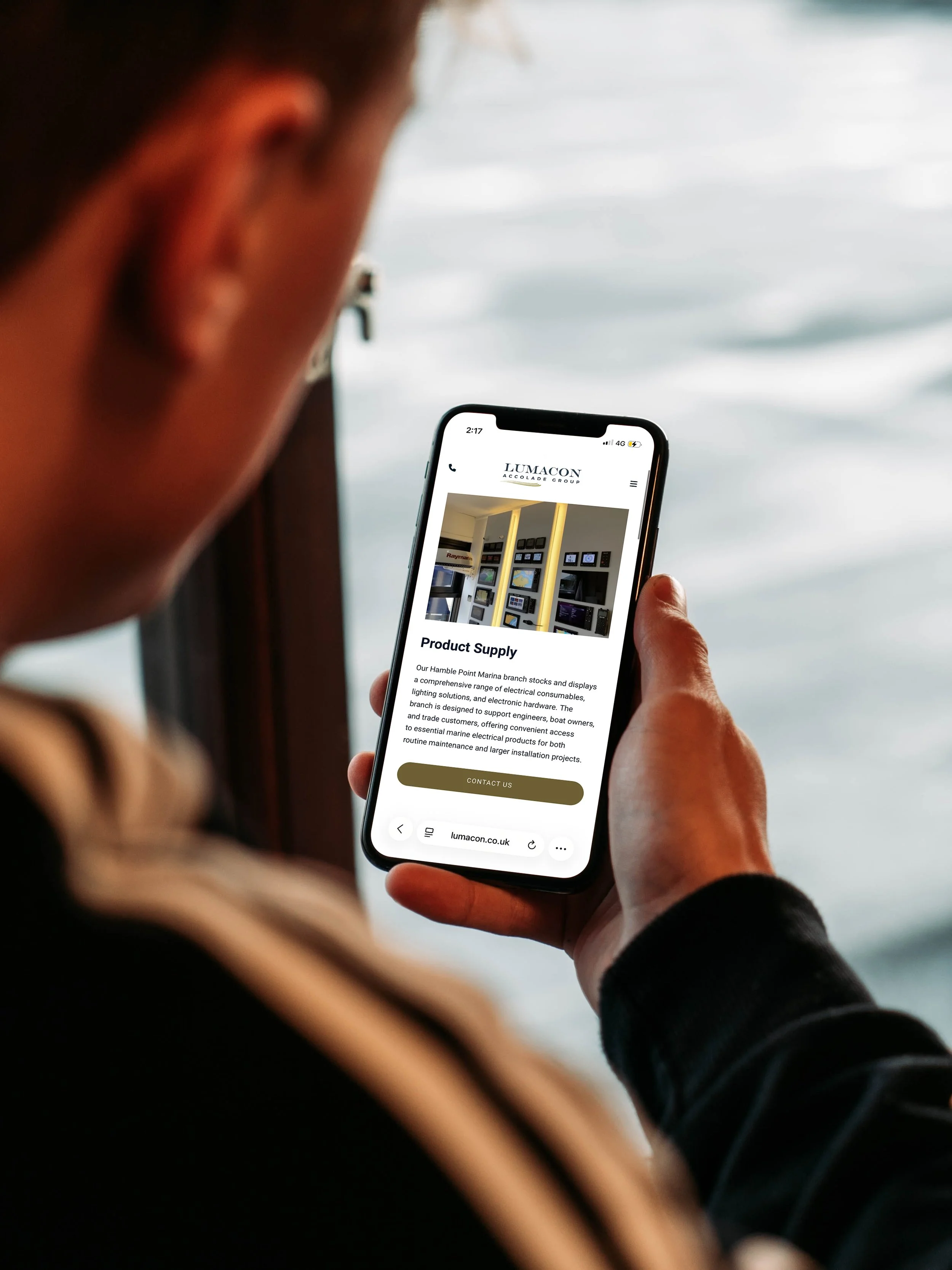 Product Supply page held on a mobile phone onboard, from the Lumacon Accolade Group marine electrical website by BCLR.
