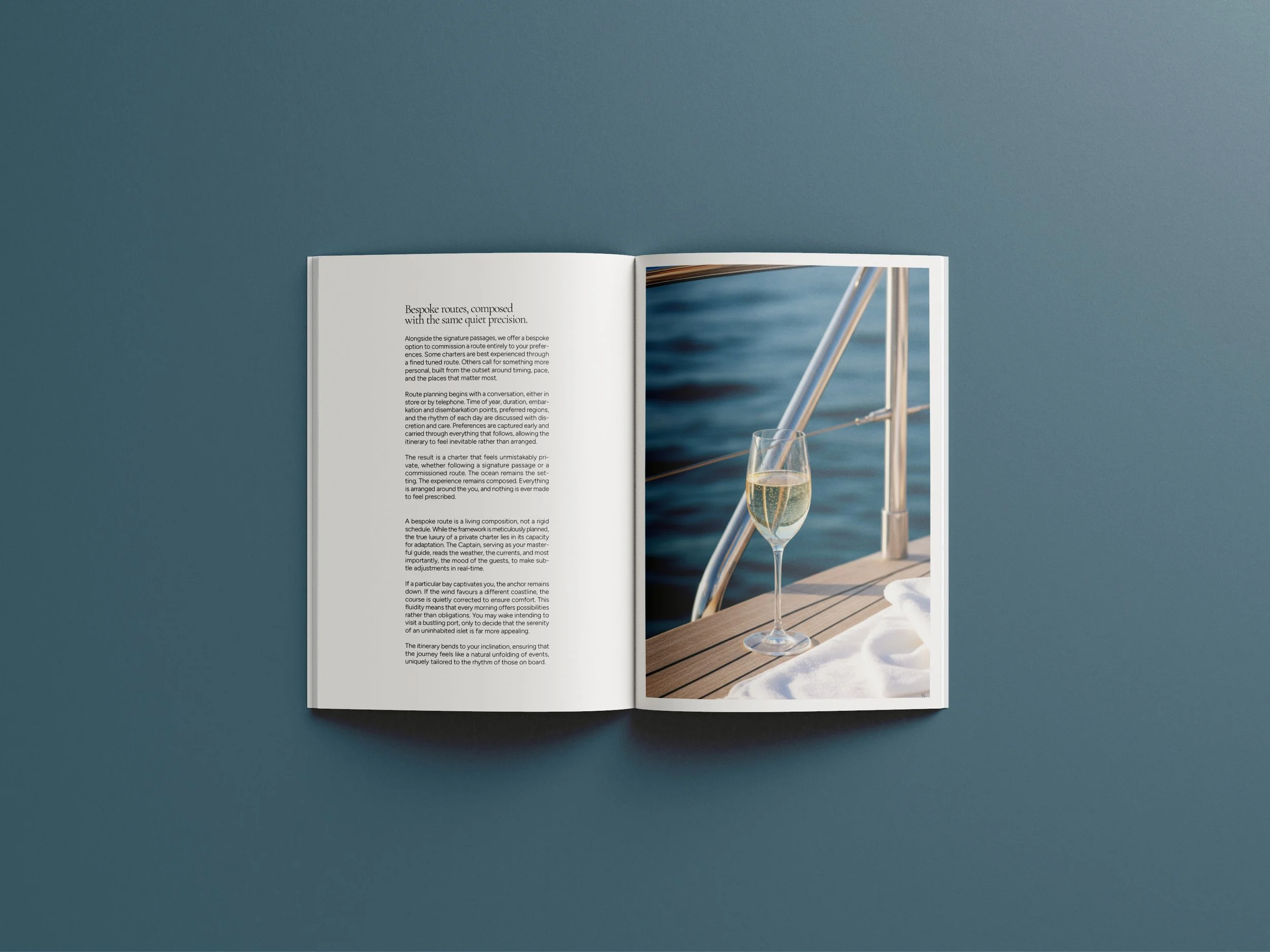 Editorial spread with a glass of champagne on a yacht for The Art Of The Charter luxury yacht brochure designed by BCLR.