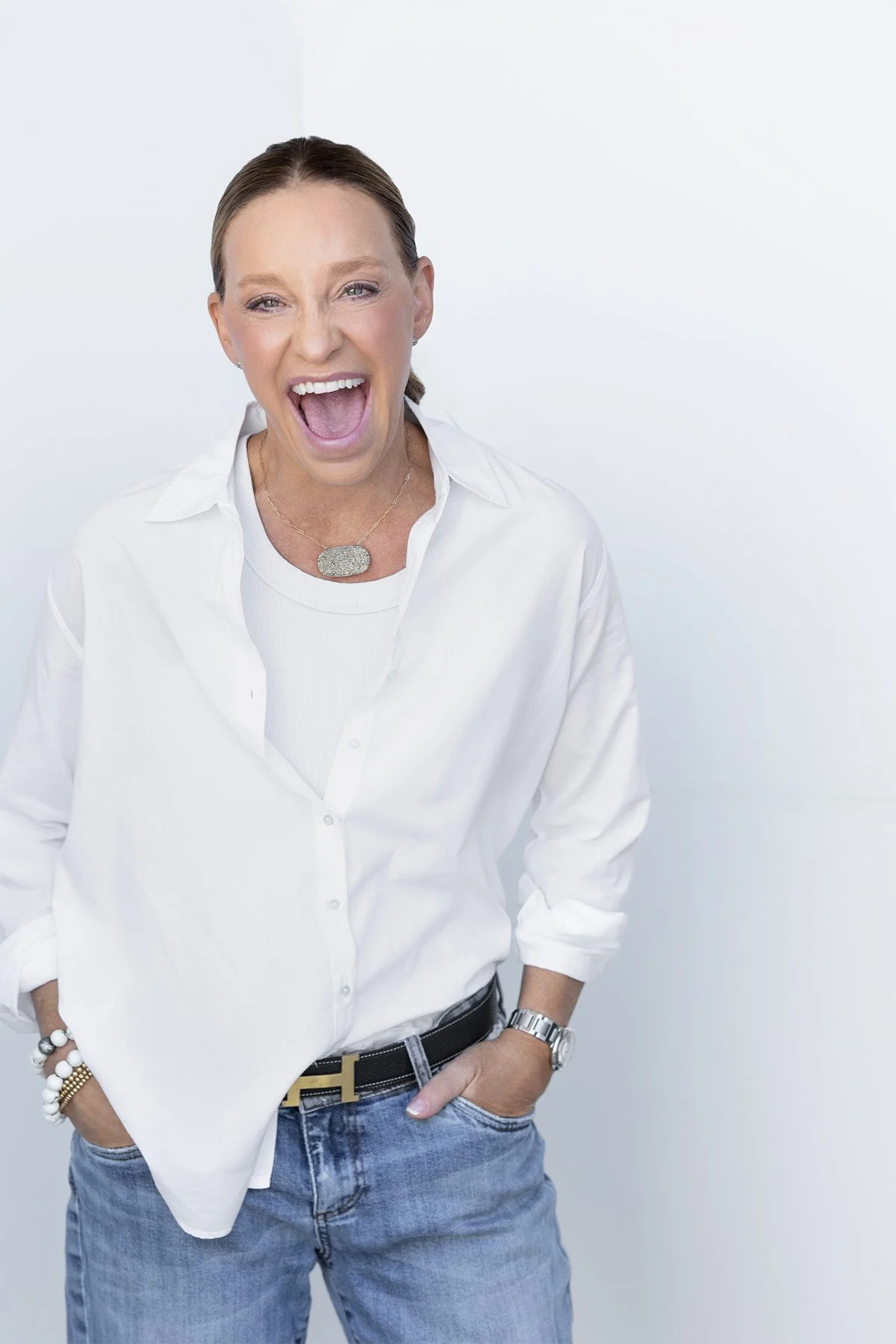 Joyful studio portrait of Gena Wueste laughing during her 40 Over 40 portrait session photographed by Newport Beach portrait photographer Alex Abercrombie