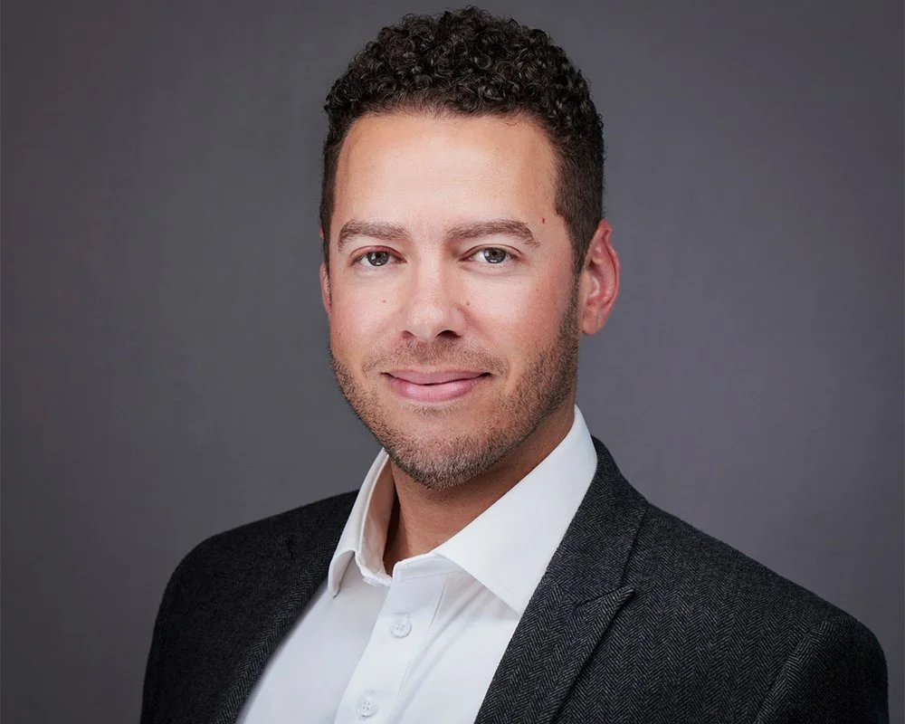 Professional executive headshot photographed in studio in Costa Mesa, serving clients across Orange County. This modern corporate portrait features clean lighting, natural expression, and a polished yet approachable look ideal for LinkedIn, company w