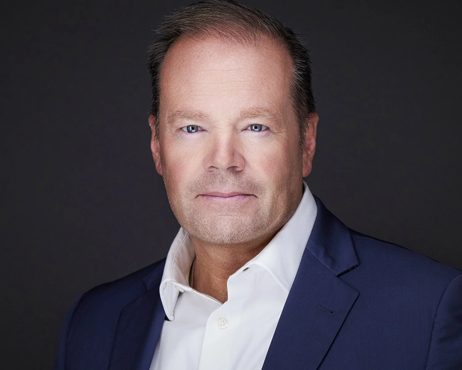 Professional headshot of an Orange County attorney, photographed in studio in Costa Mesa. This executive portrait was created for a strong, approachable presence across LinkedIn, law firm websites, and professional marketing materials.