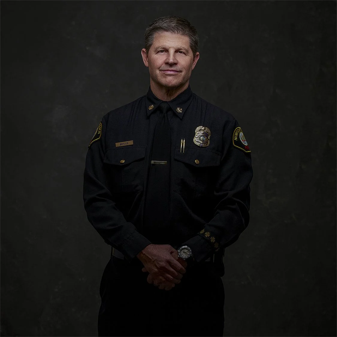 Jeff Bowles, Fire Chief of Newport Beach, photographed in my Costa Mesa studio. A moody editorial-style portrait created with dramatic lighting, deep tones, and a refined, authoritative feel for professional branding and executive portrait use.