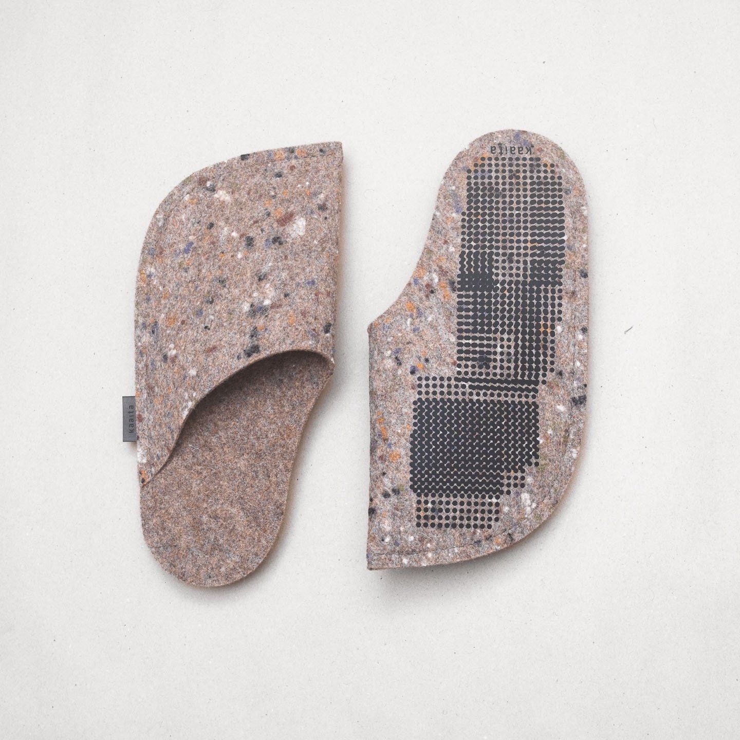 Kaaita beige non-slip wool slippers with spots made from recycled woolen pullovers.