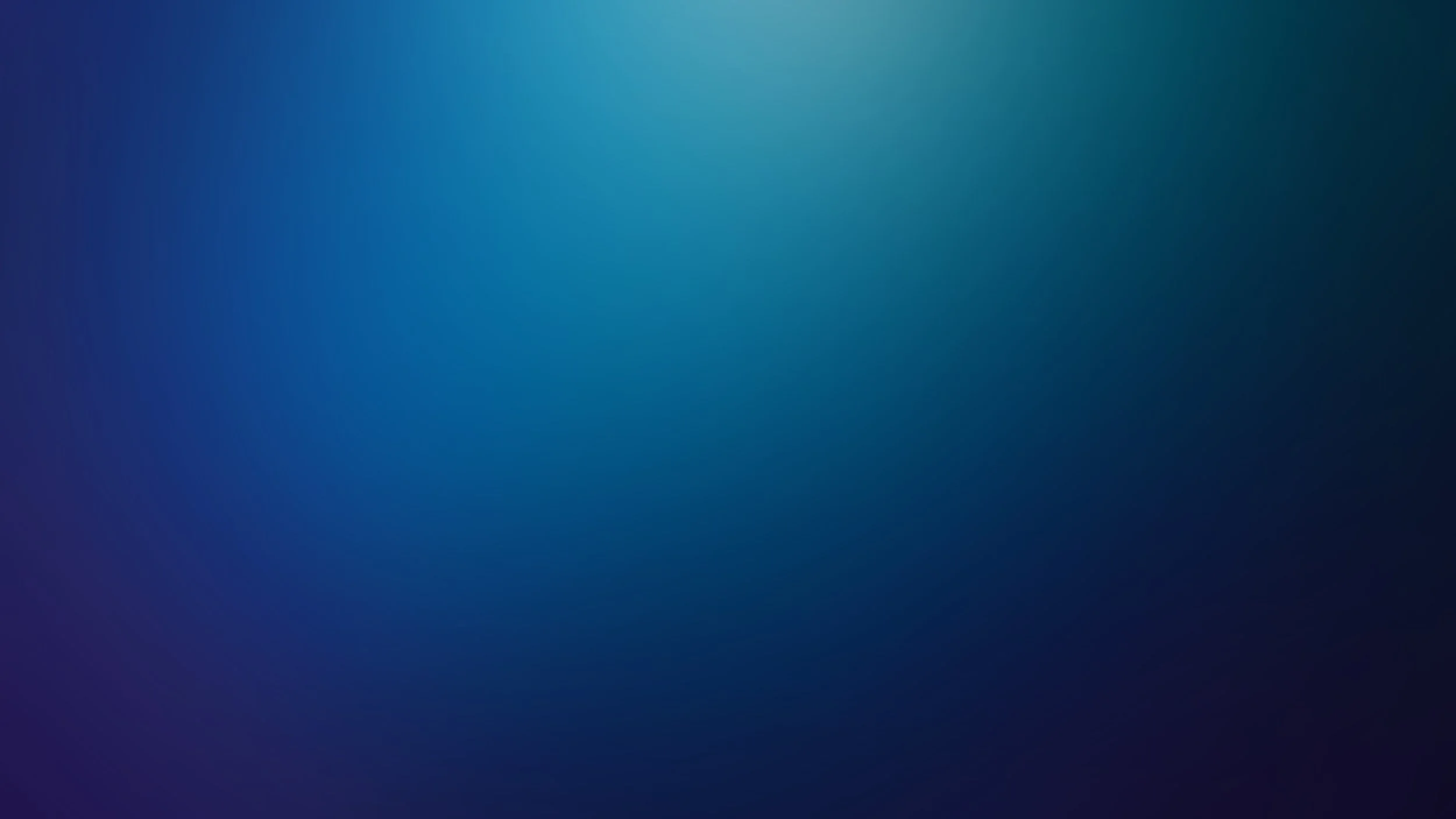 A blurred metallic surface with a gradient of gray tones.