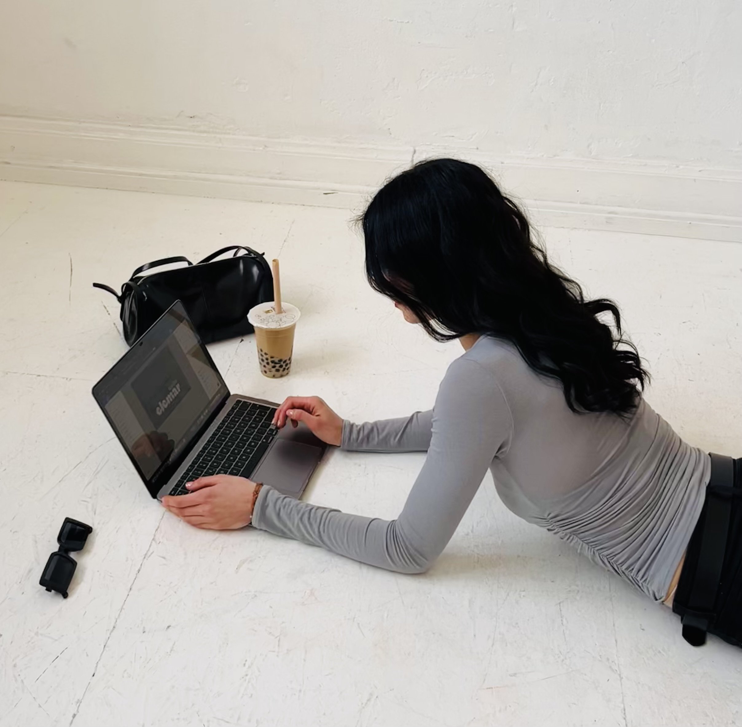 Virtual Assistant and Project Manager Marina working on a laptop on some design work