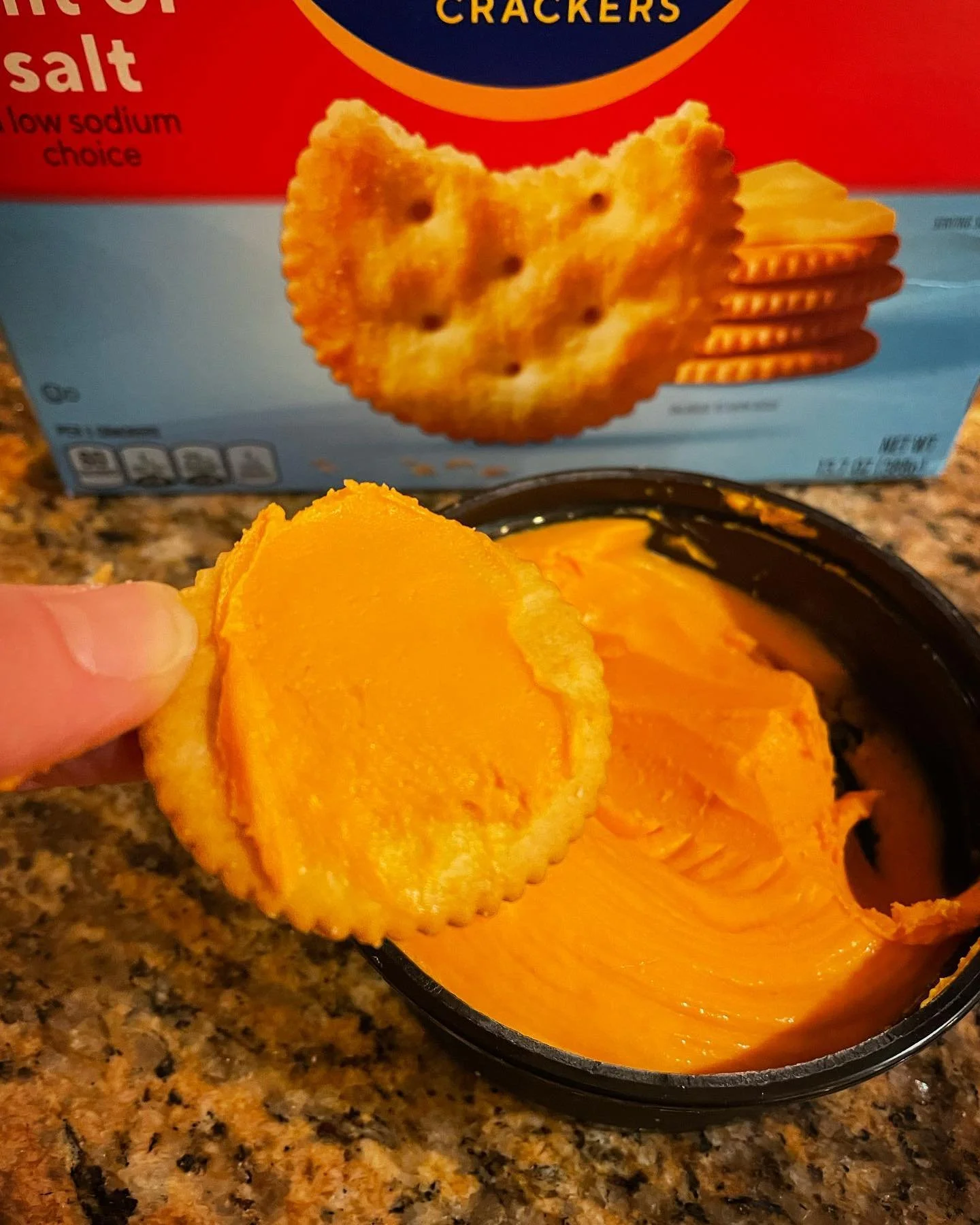 It must be Michigan!  Schuler&rsquo;s sharp cheddar bar cheese spread on a ritz cracker.  Tastes like the 80s!