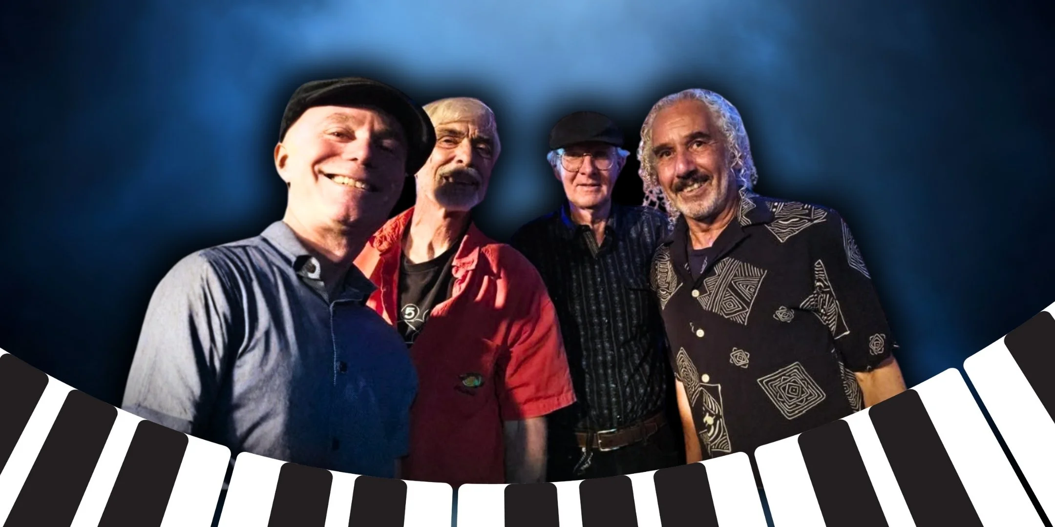 Four men standing together, smiling, with a blue background and a black and white keyboard border at the bottom. The West Coast Blues Revue.