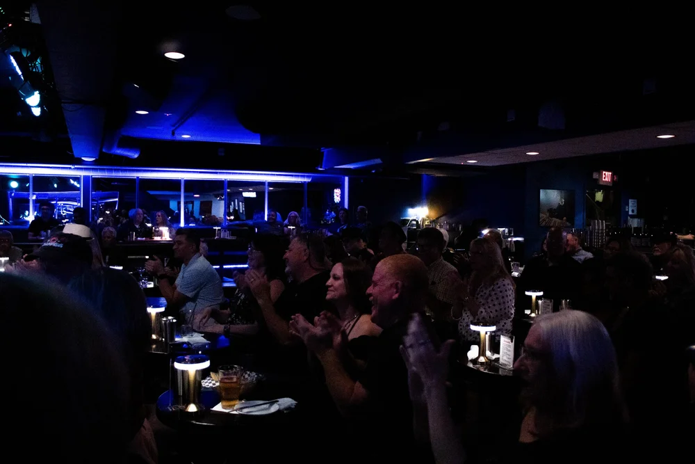 Audience applauding at their tables at Biscuits and Blues