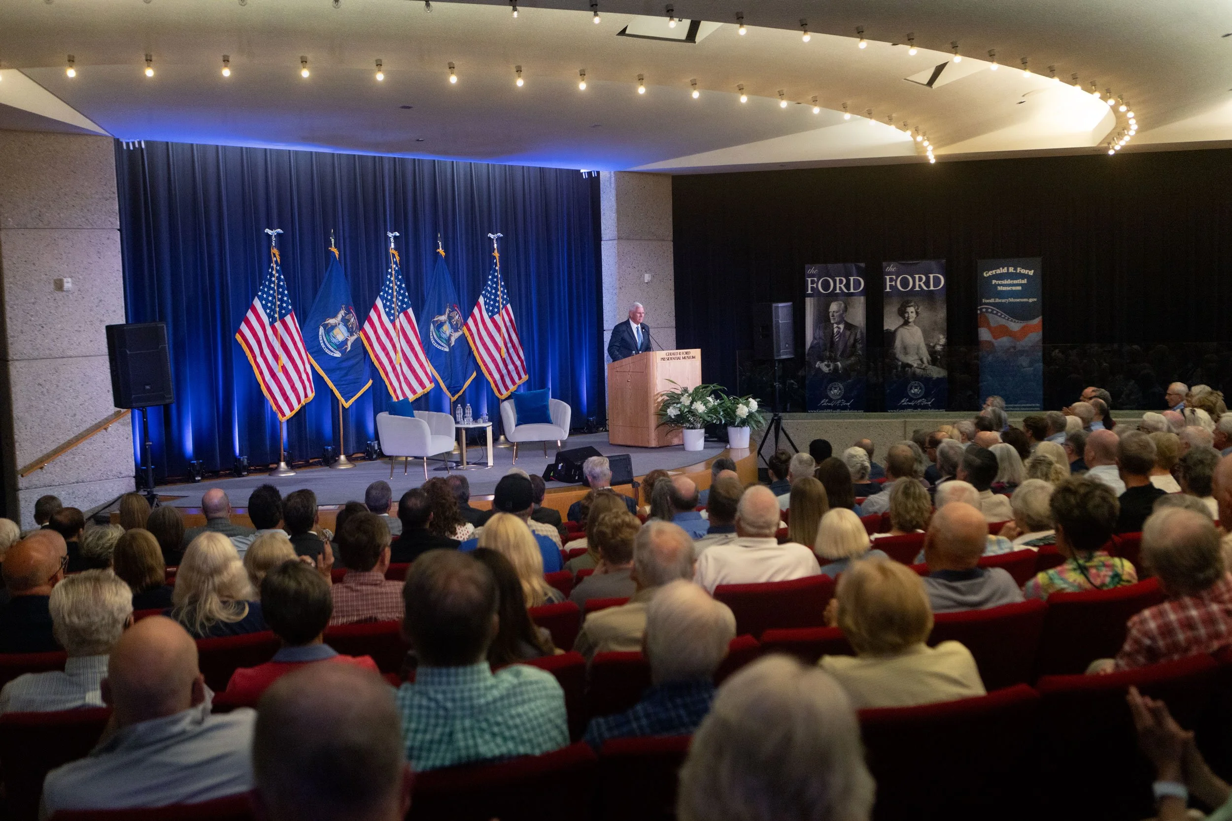 Mike Pence addresses the crowd at the Ford Presidential Museum on June 23, 2026.