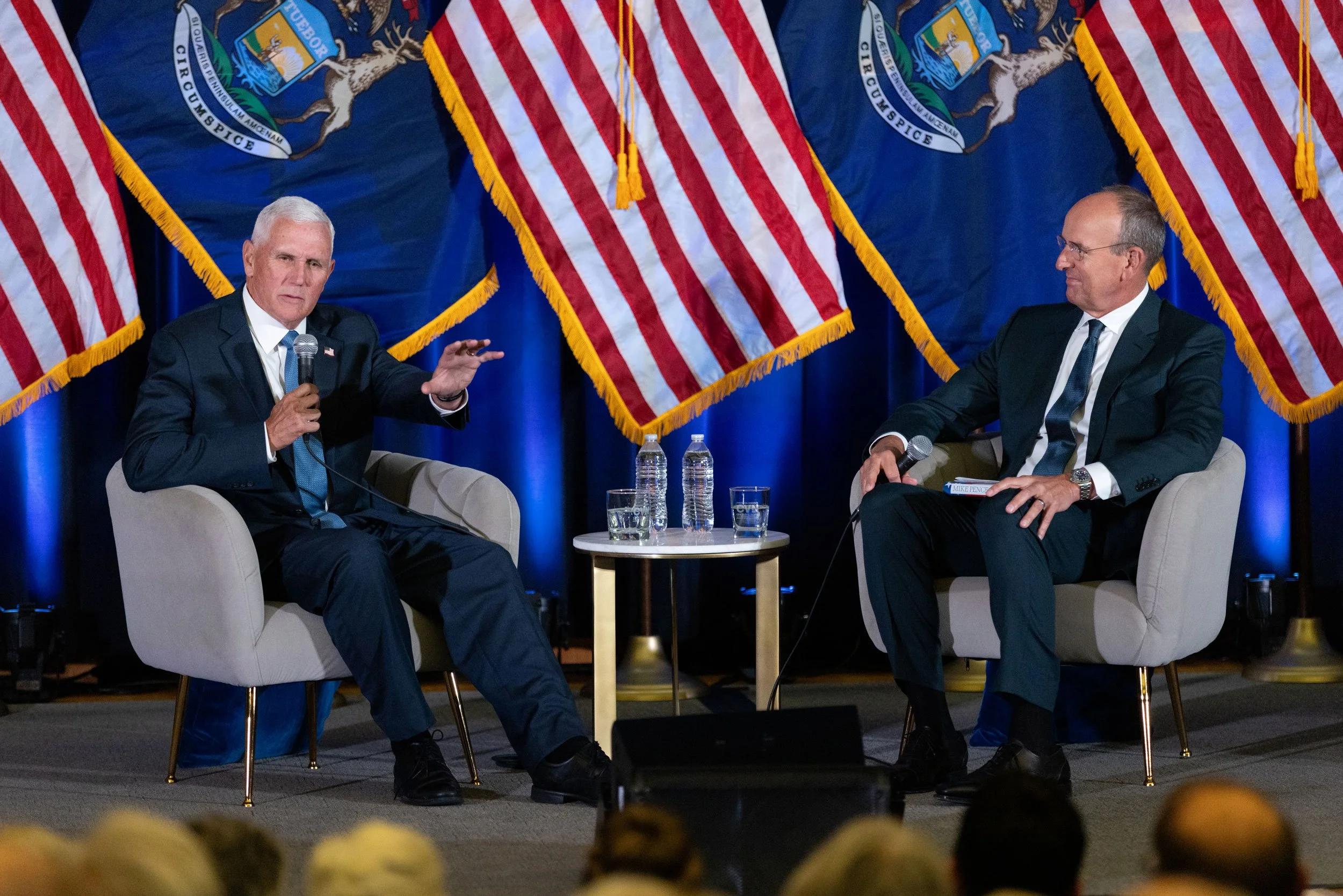 Vice President Mike Pence (left) with moderator and Foundation trustee Douglas DeVos at the Gerald R. Ford Presidential Museum on June 23, 2026.