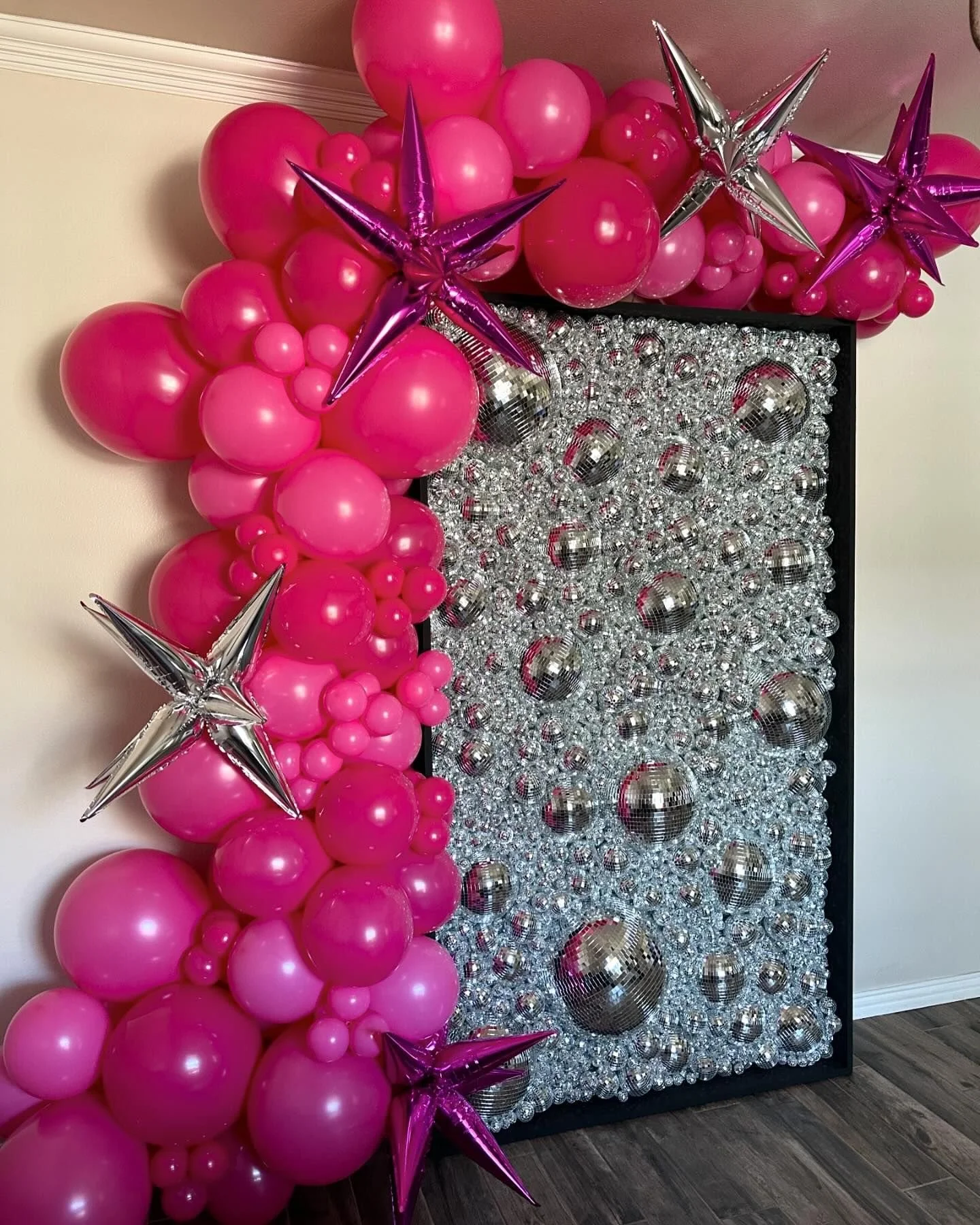 disco wall with 10-12 ft balloon garland and starburst foils
