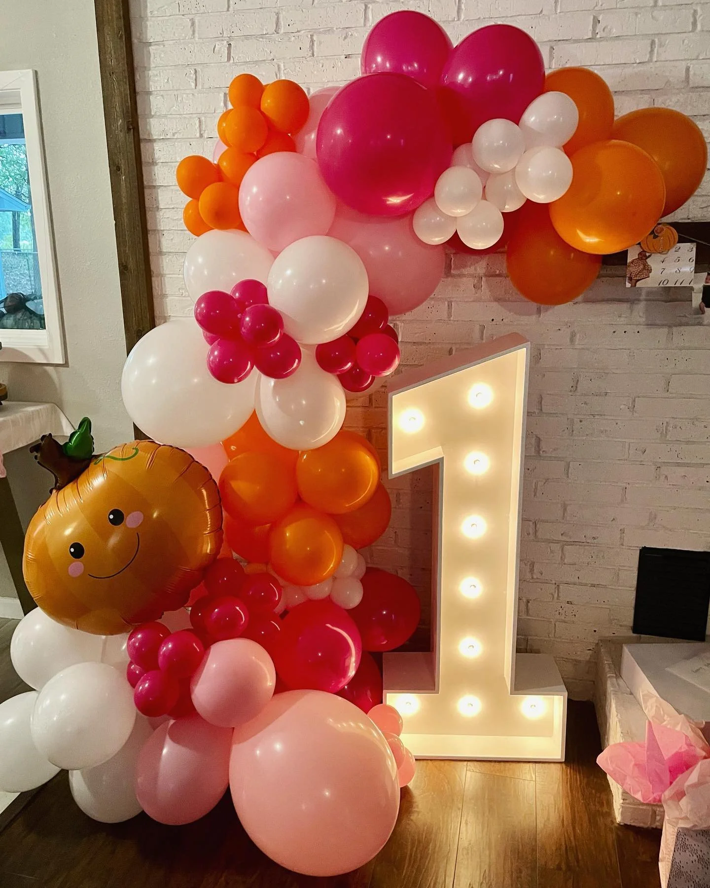 marquee number 1 and balloon garland with foils