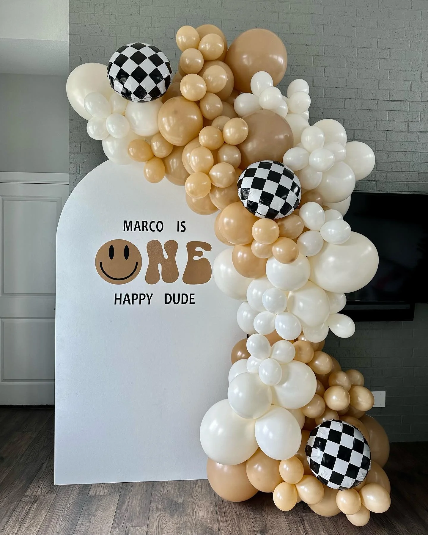 7x4 wood arch backdrop with vinyl and 8-10 ft balloon garland with checkered foils