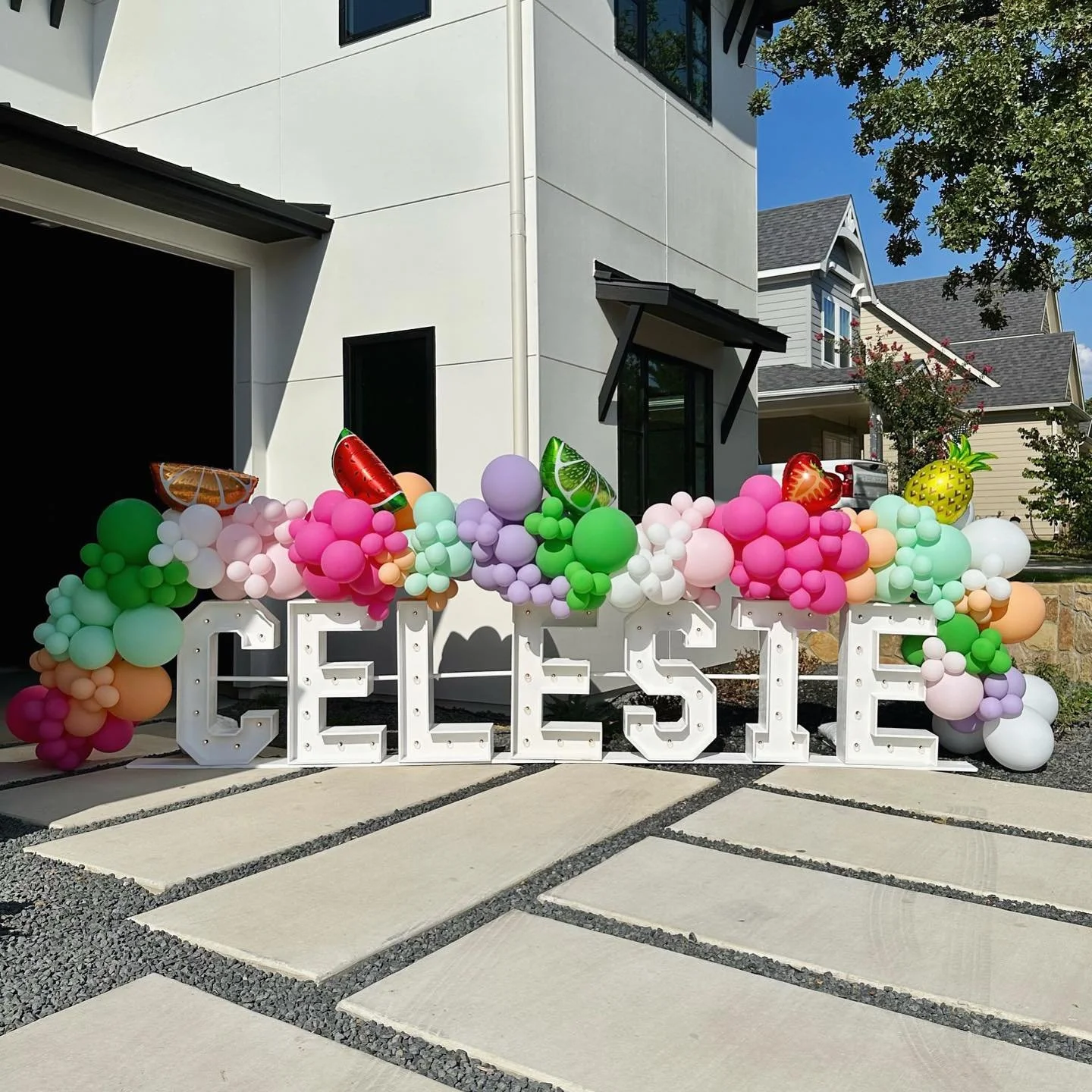 marquee letters and balloon garland with foils