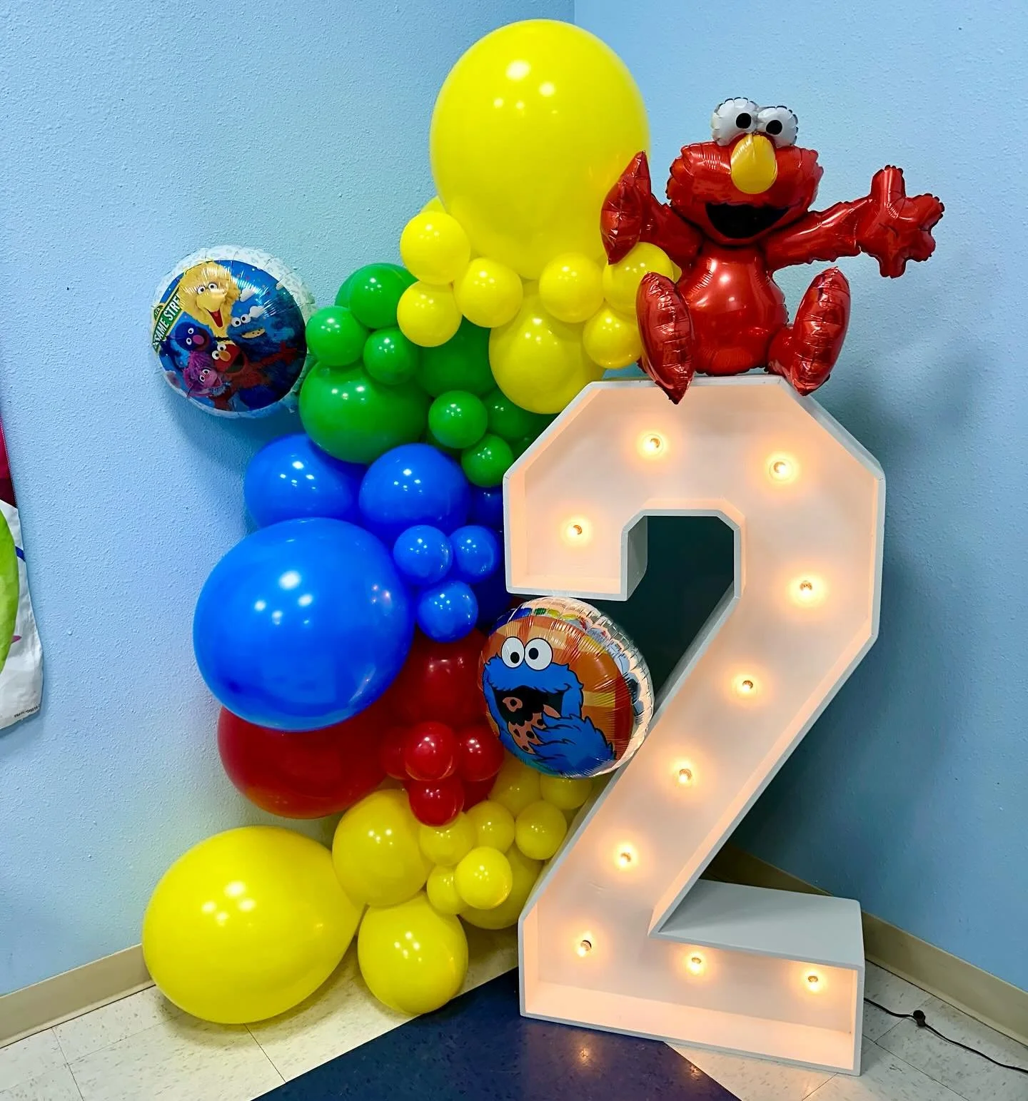 marquee number 2 with balloon garland and foils