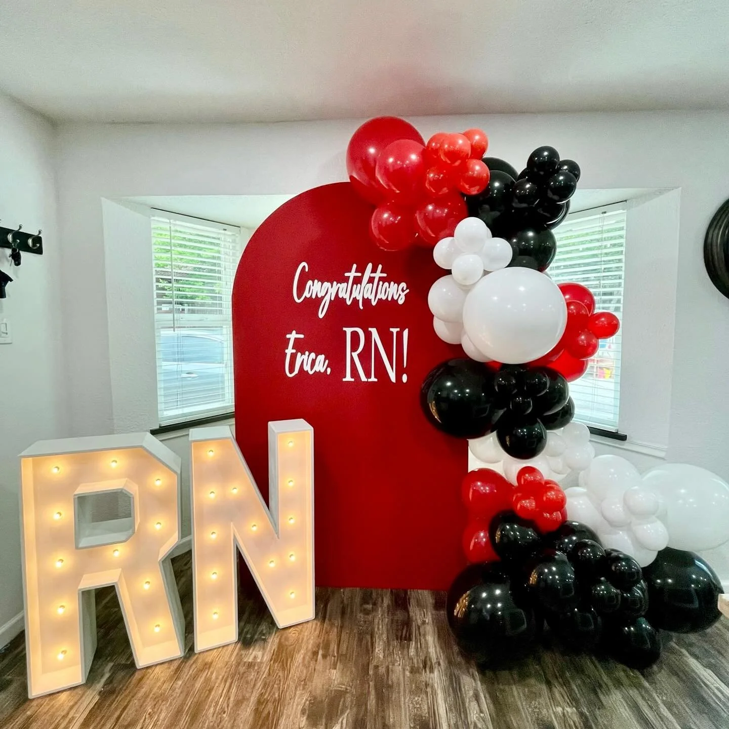 7x4 wood arch backdrop with vinyl and 8-10 ft balloon garland and marquee letters