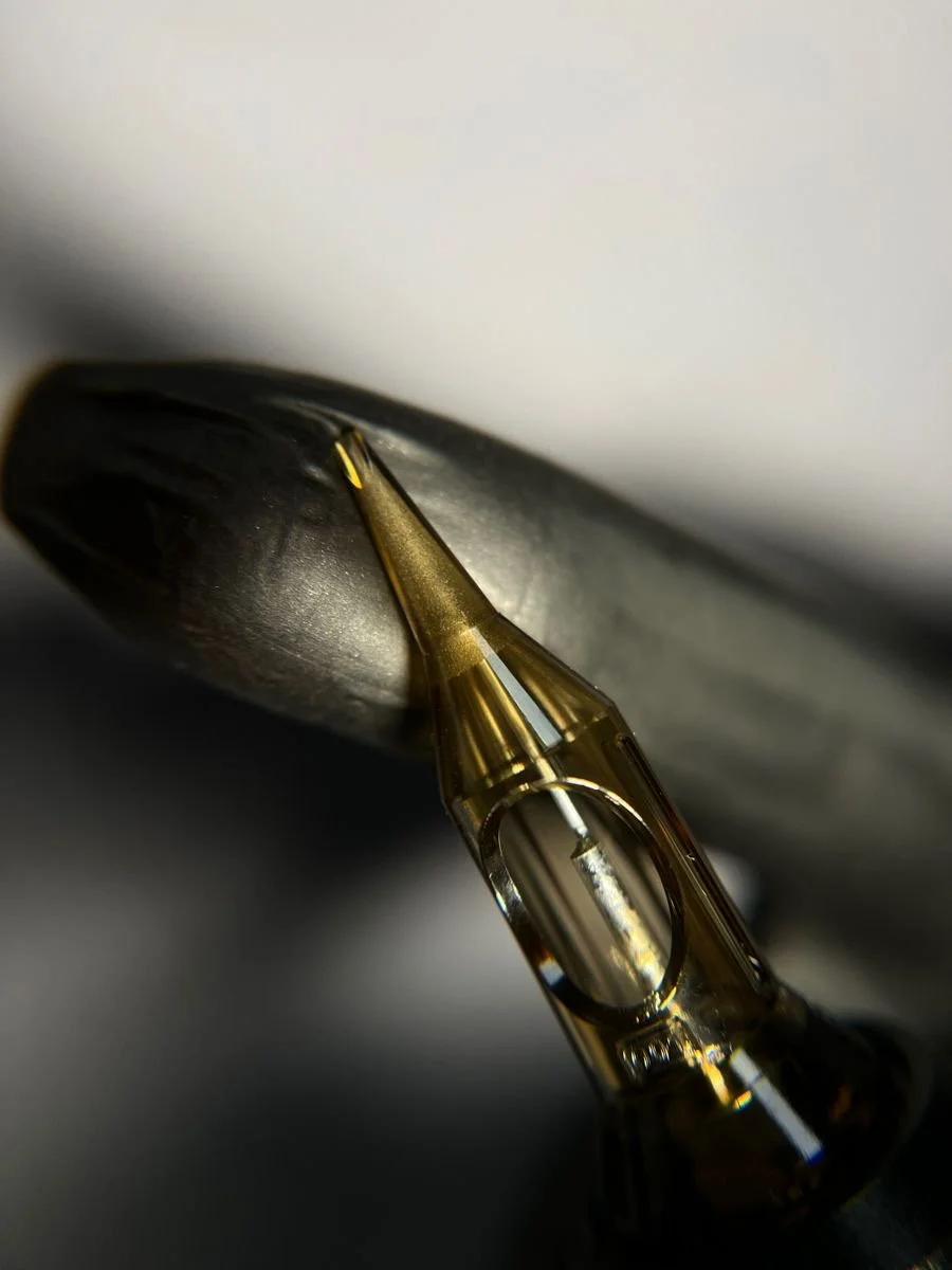 Close-up of a pmu/tattoo needle