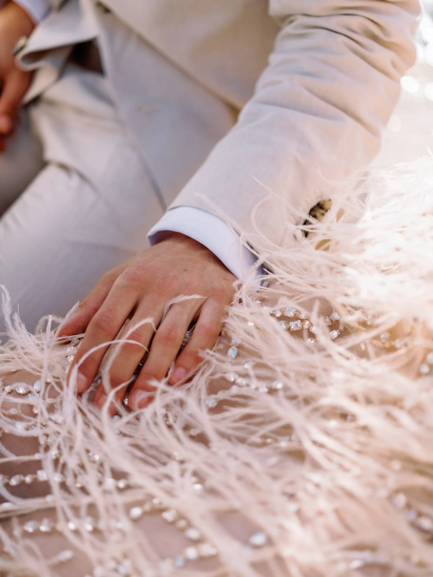 Groom putting his hands on the bride's beautiful vintage Oscar de la Renta wedding dress in Zakynthos Greece during their elopement