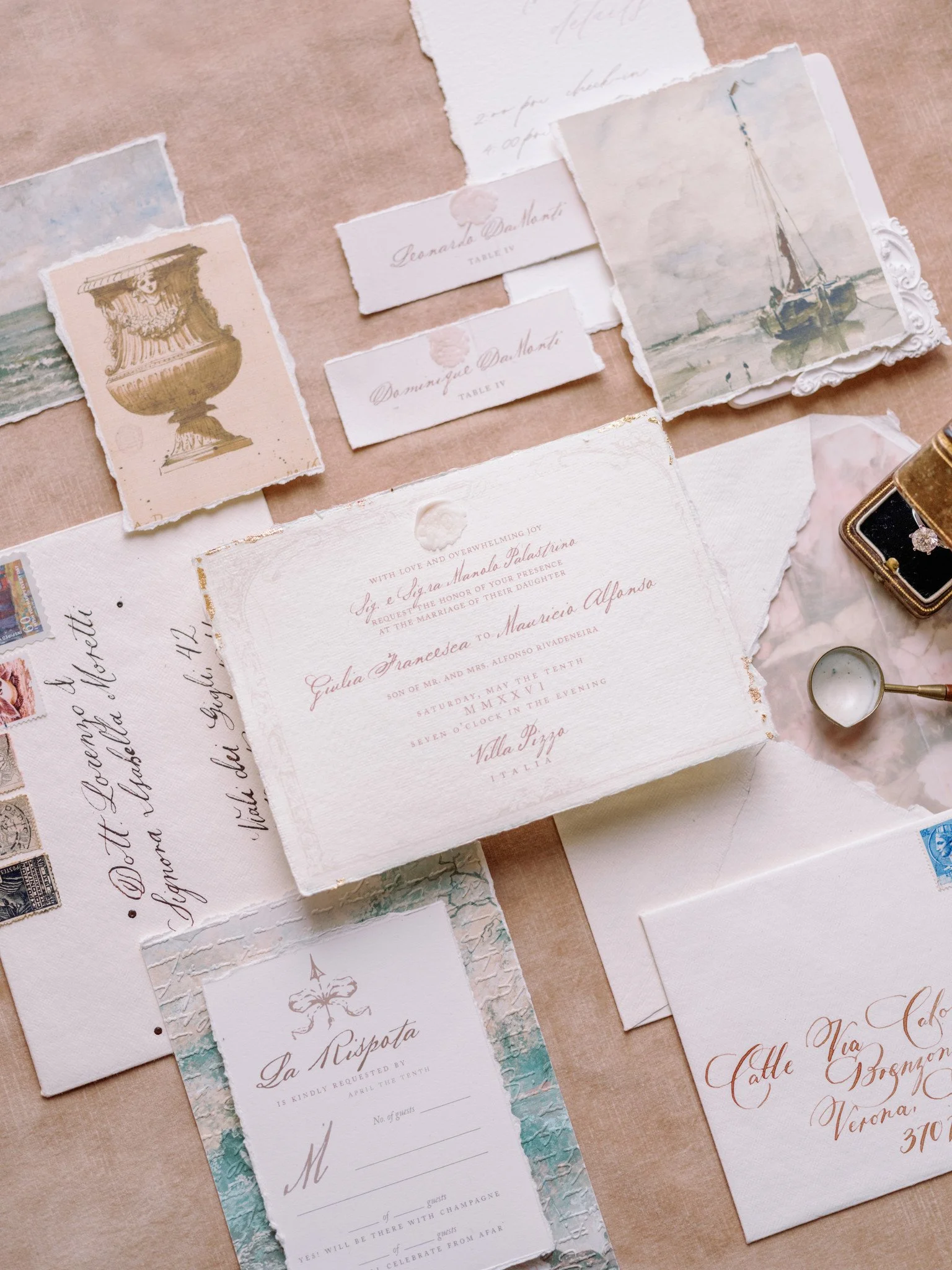 Dreamy wedding invitation suite for an intimate wedding at Villa Pizzo on Lake Como, Italy, featuring hand-painted Italian-inspired illustrations, handwritten calligraphy, vintage postage stamps, a wax seal, and engagement ring.