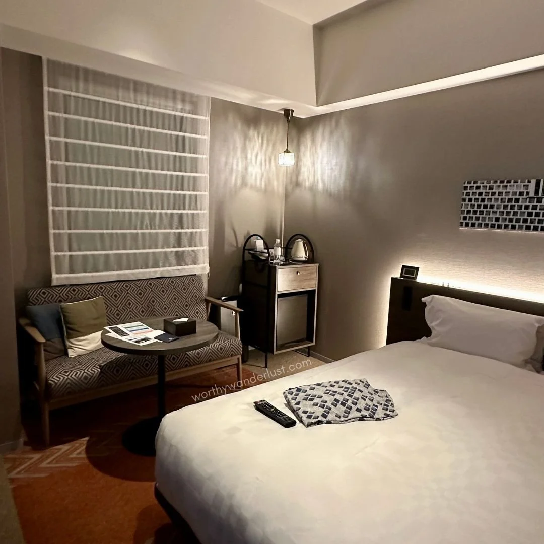 Cozy room with bed in Royal Park Hotel Kurashiki