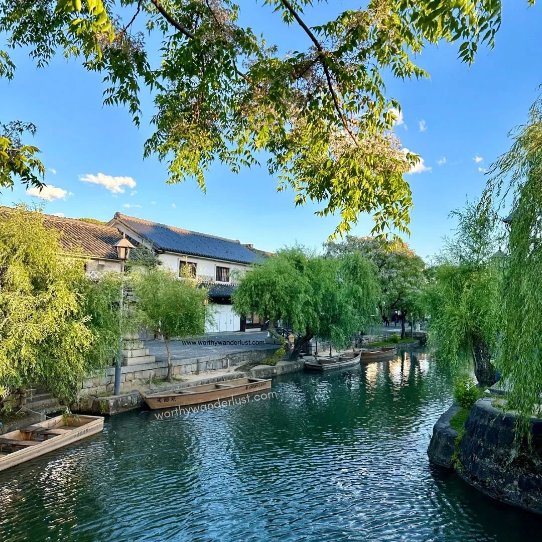 Tree-linked banks of a Kurashiki river with boats