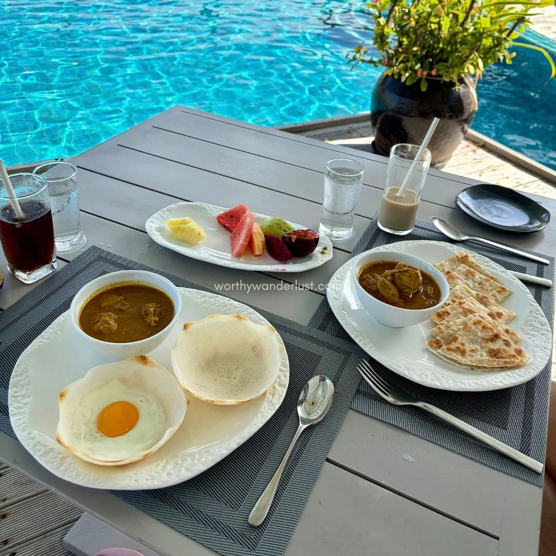 Hoppers and prata with chicken curry, by the pool.