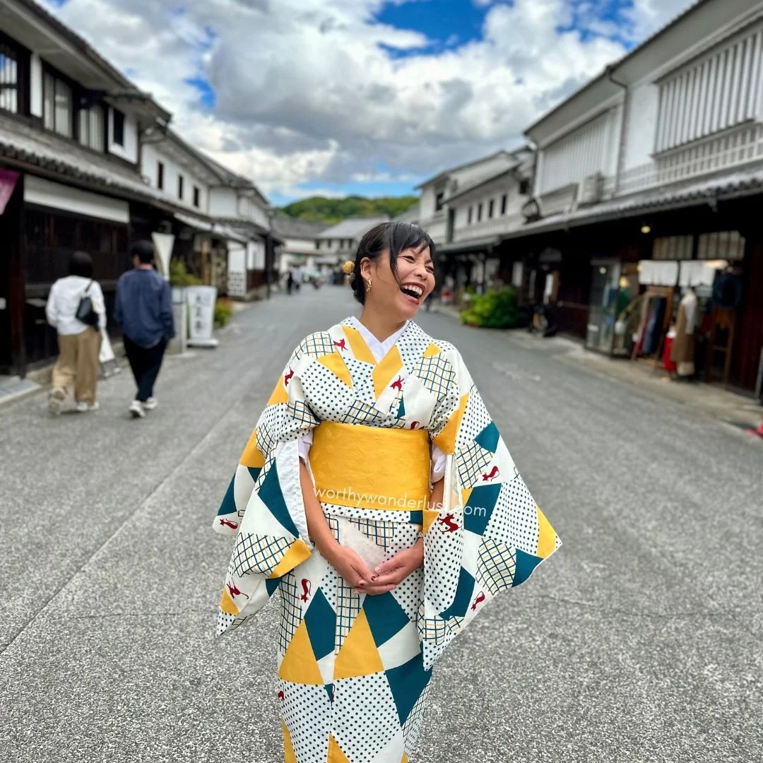 Worthy Wanderlust founder happily laughing in Kurashiki Bikan HIstorical Quarter