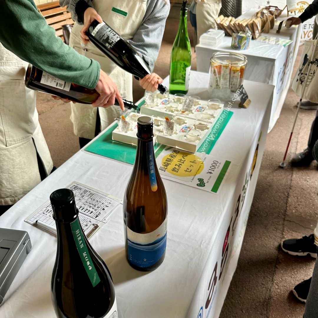 Sake vendors pouring sake into tasting cups