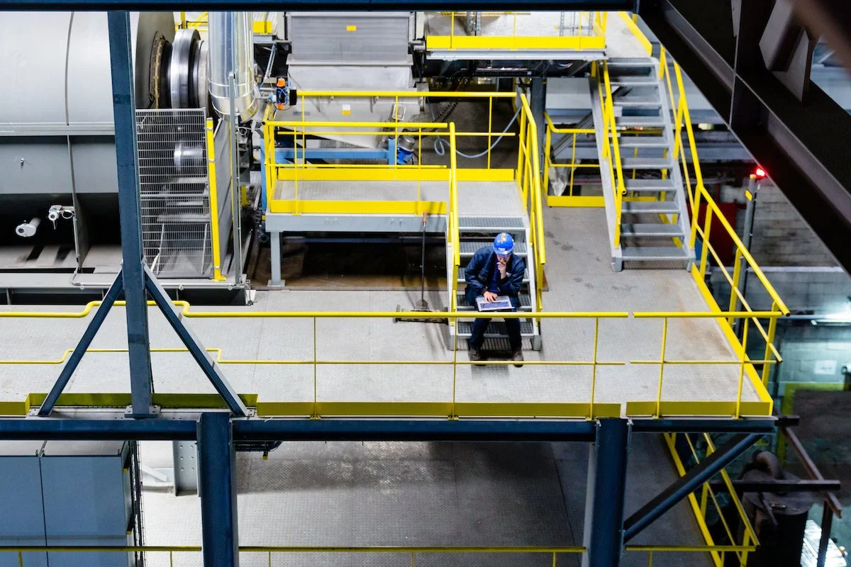 Man working on a computer in a factory