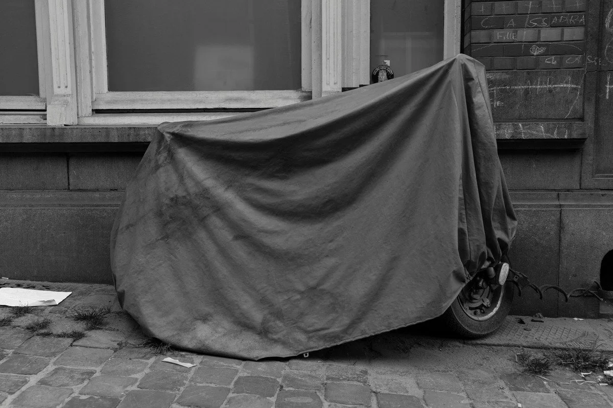 Photograph of a vehicle covered for protection